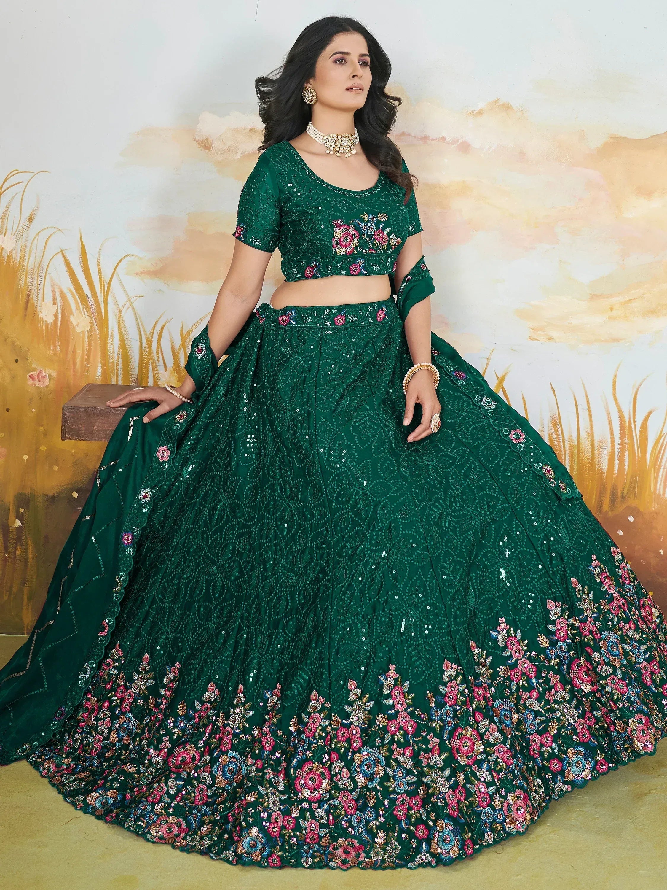 Emerald green designer lehenga choli with floral embroidery and sequins, perfect for Indian ethnic wear.