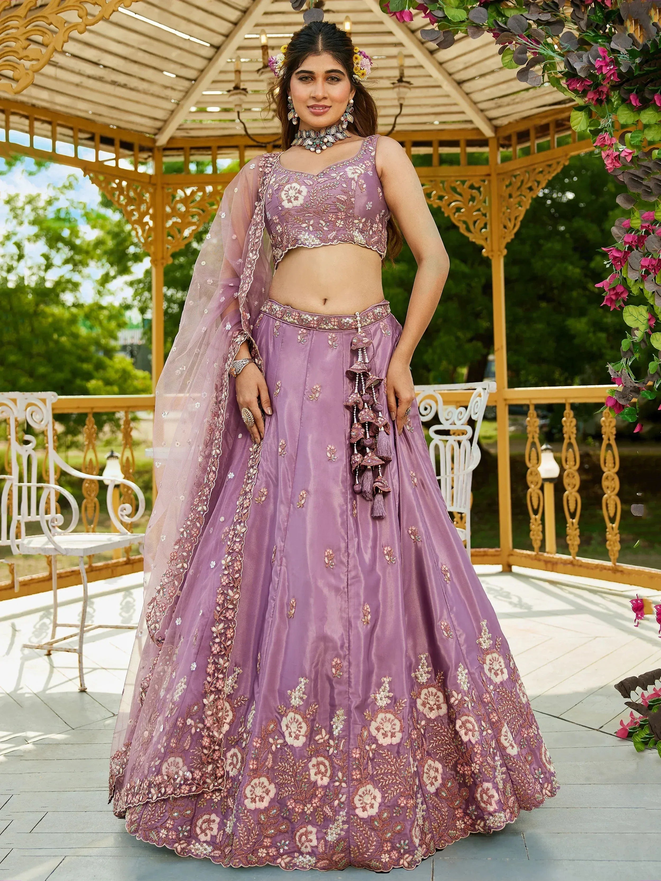 Lavender embroidered lehenga choli with floral motifs, tassels, and sheer dupatta for Indian ethnic wear