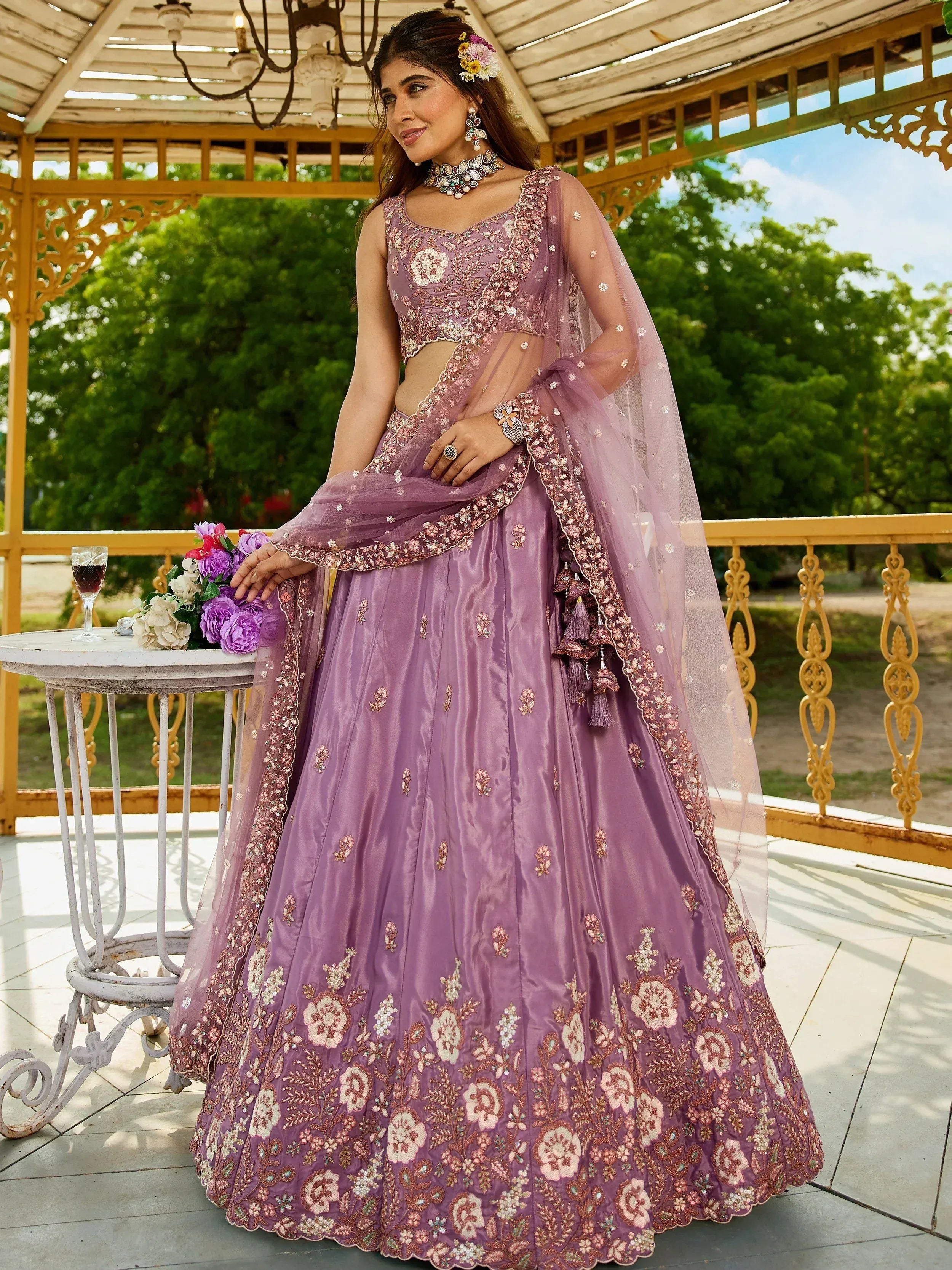 Elegant purple embroidered lehenga choli with floral designs, perfect for Indian ethnic wear.