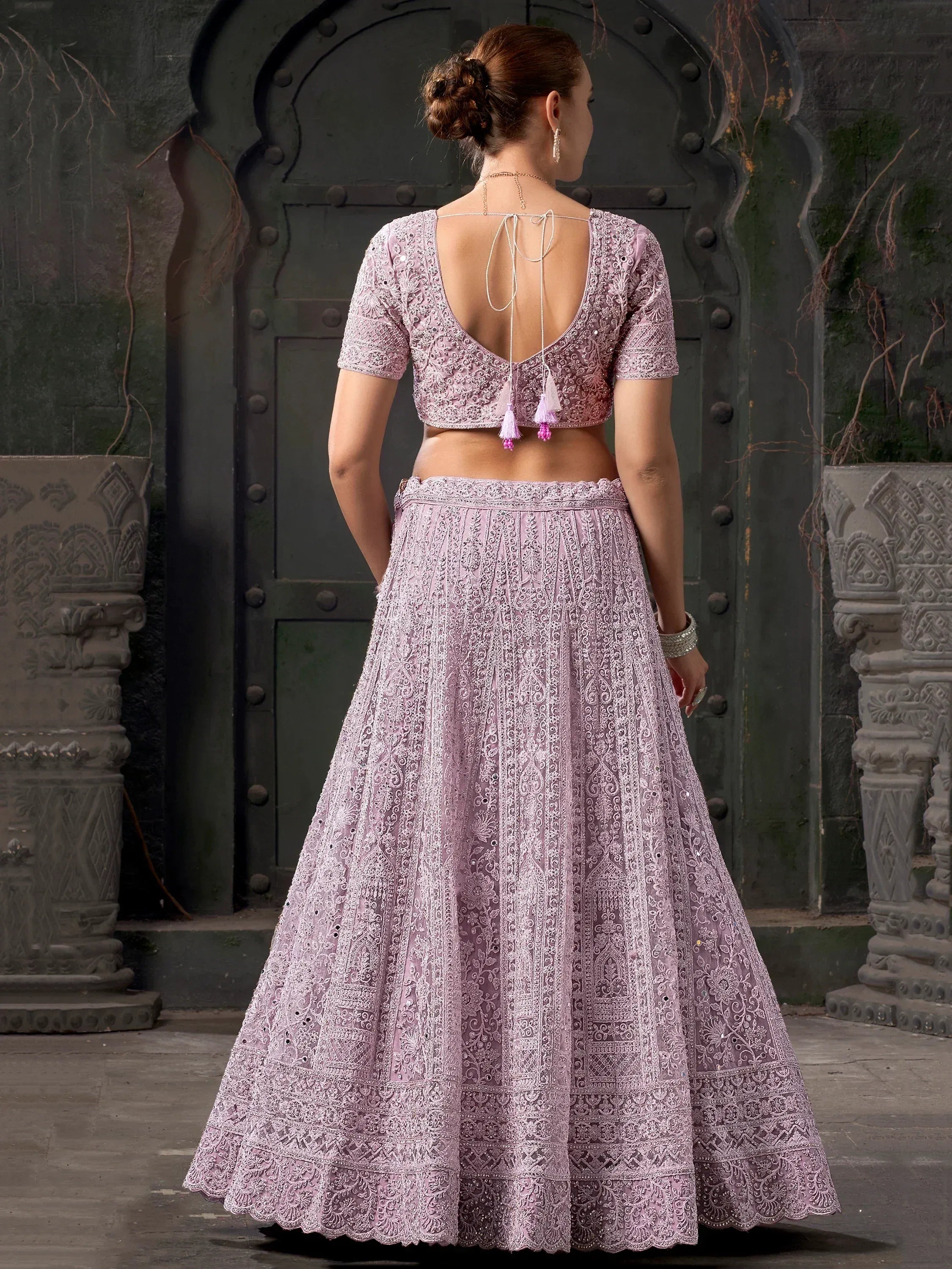 Lavender embroidered lehenga choli with back tie blouse, perfect for Indian ethnic wear events.