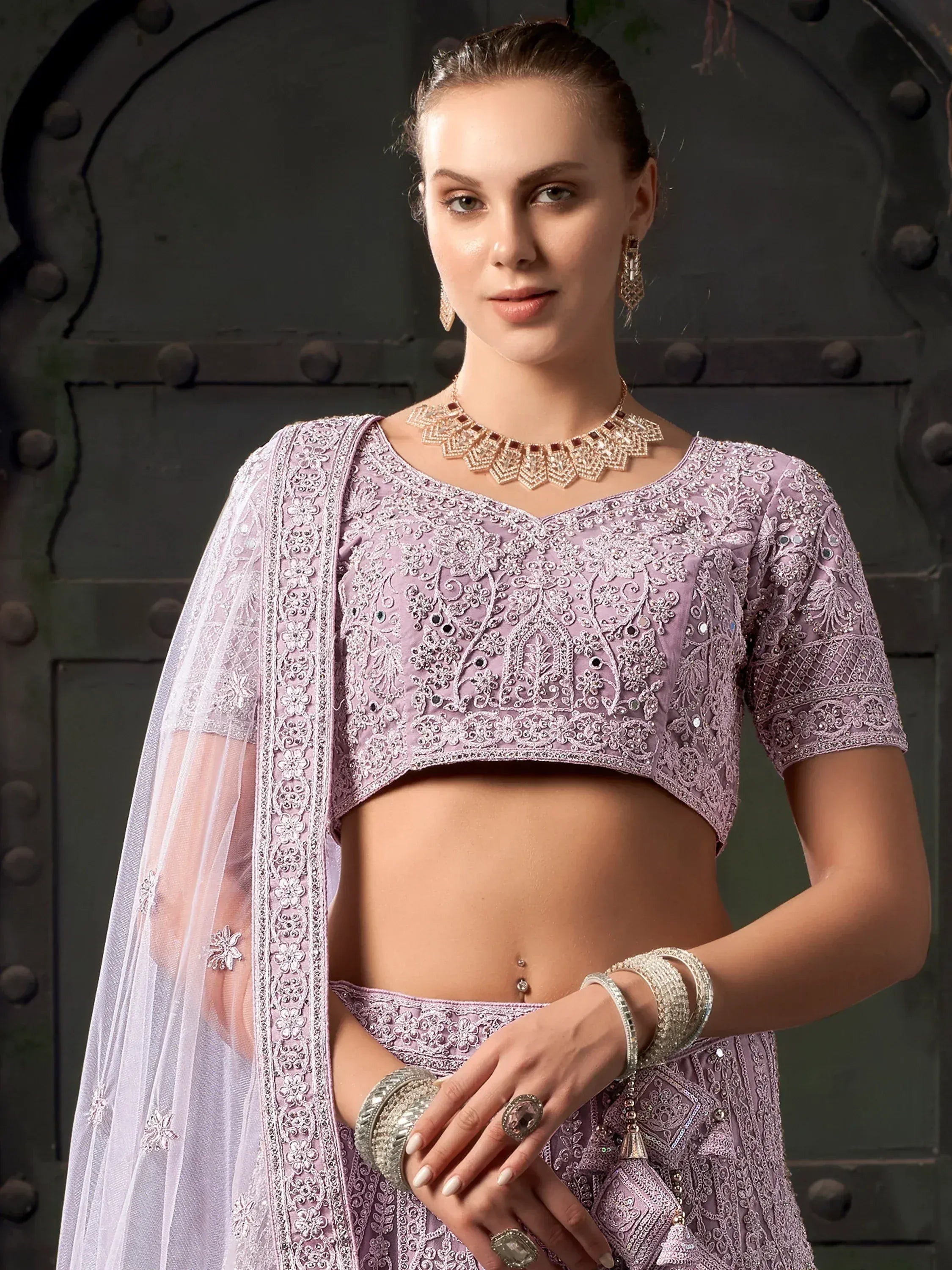 Lavender embroidered lehenga choli with sheer dupatta, perfect for Indian ethnic wear occasions.