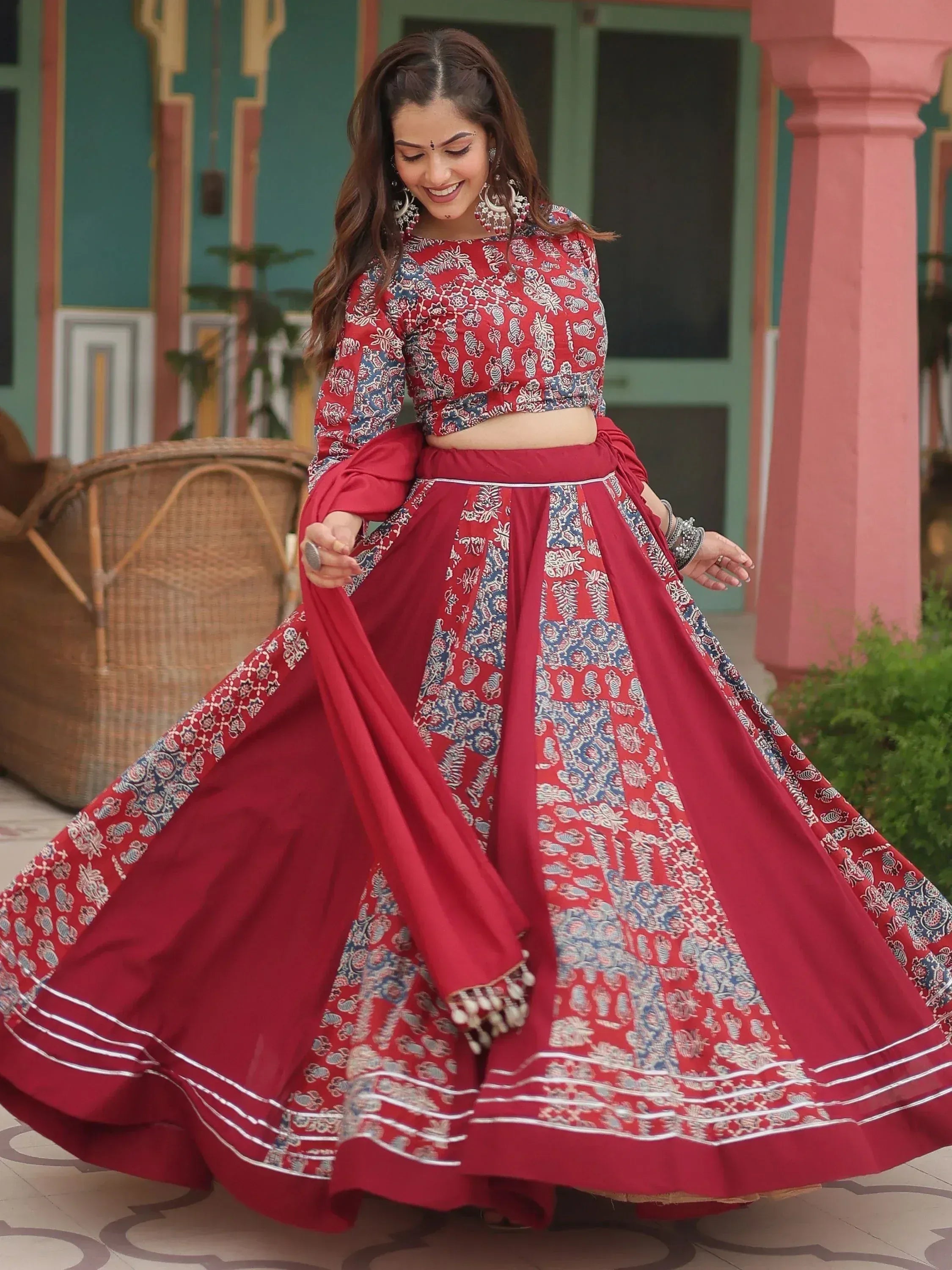 Red and blue printed lehenga choli with flared skirt, perfect for Indian ethnic wear occasions