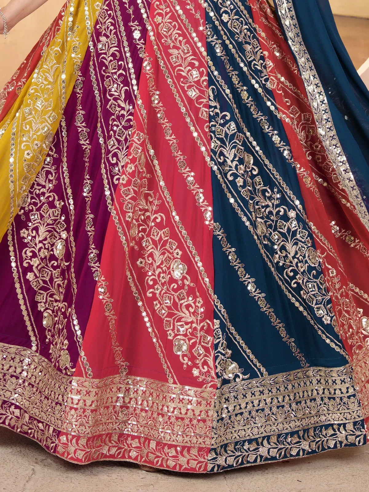 Multicolor embroidered lehenga choli with gold floral patterns and sequin detailing for Indian ethnic wear
