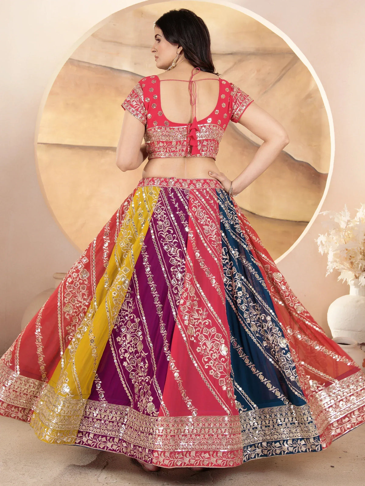 Multicolor embroidered lehenga choli with back tie blouse, perfect for Indian weddings and festive occasions