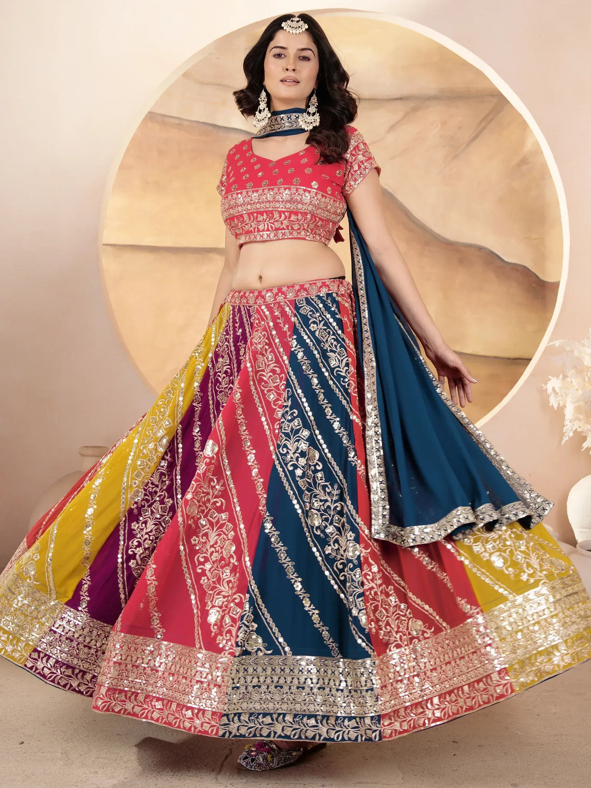 Woman in vibrant multicolor lehenga choli with gold embroidery and dupatta, Indian ethnic wear