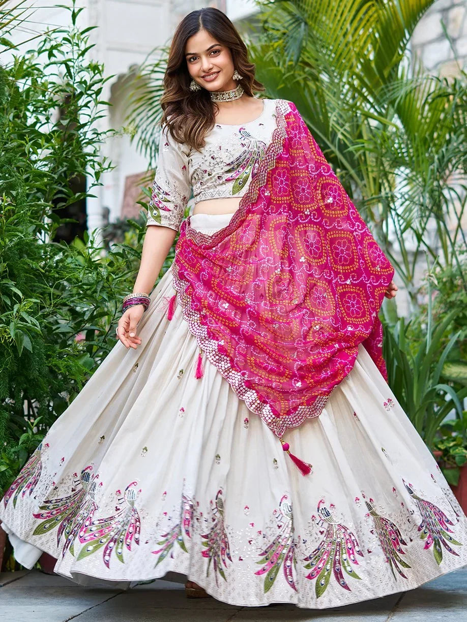 White peacock-embroidered lehenga choli with pink dupatta, perfect for Indian ethnic wear occasions