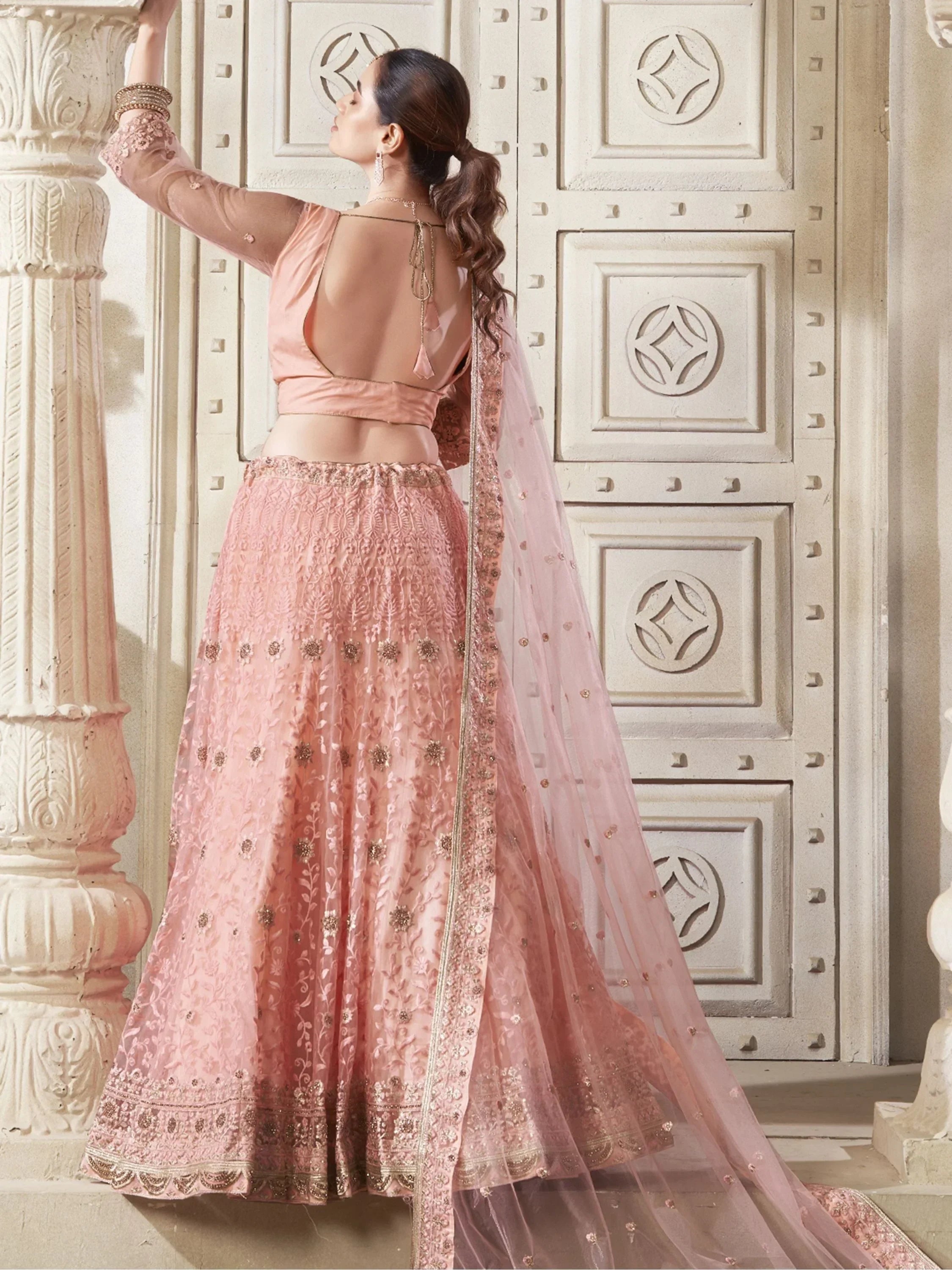 Pink embroidered lehenga choli with sheer dupatta, back view, Indian ethnic wear