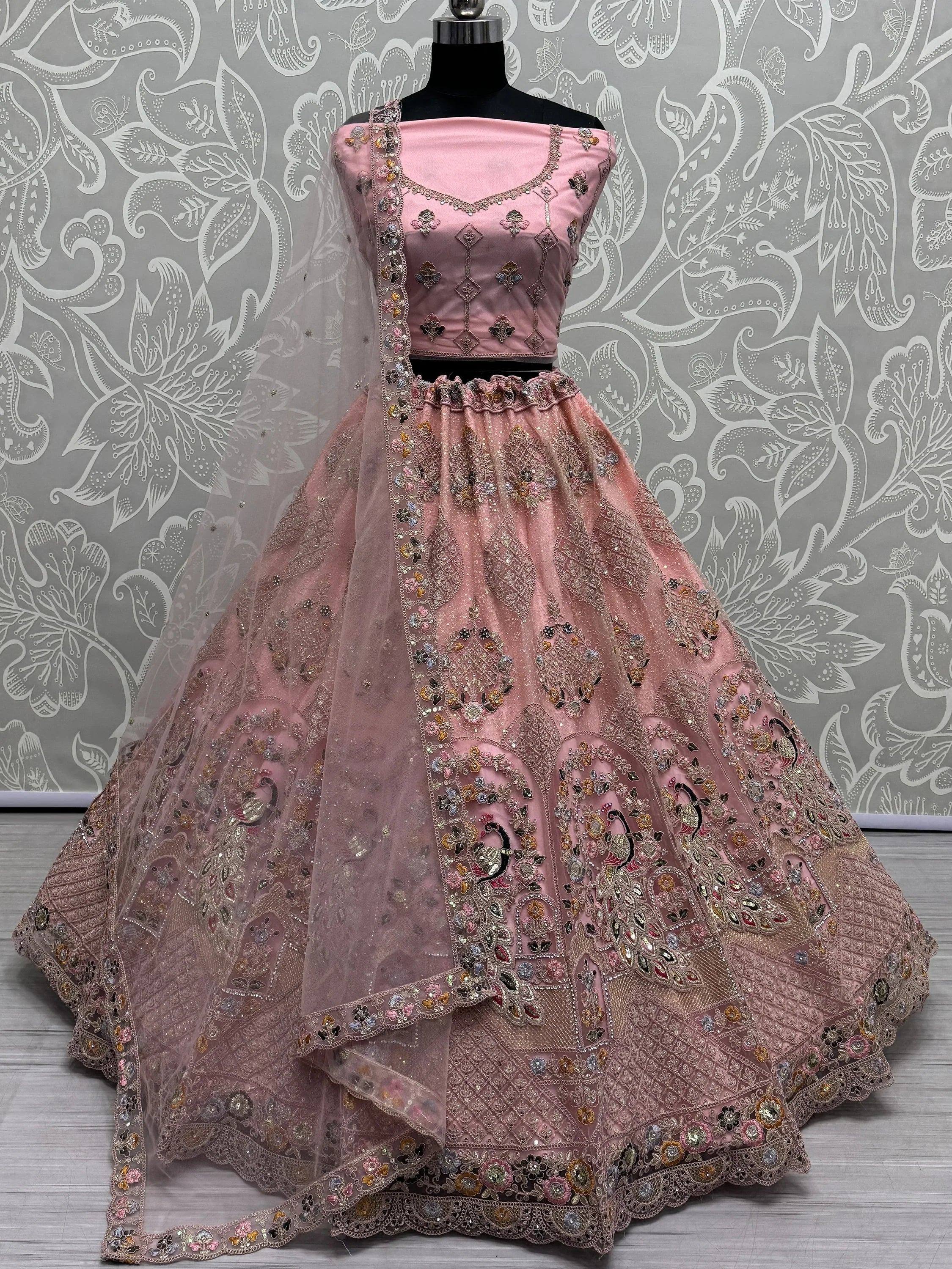 Pink embroidered lehenga choli with peacock motifs and net dupatta, Indian ethnic wear