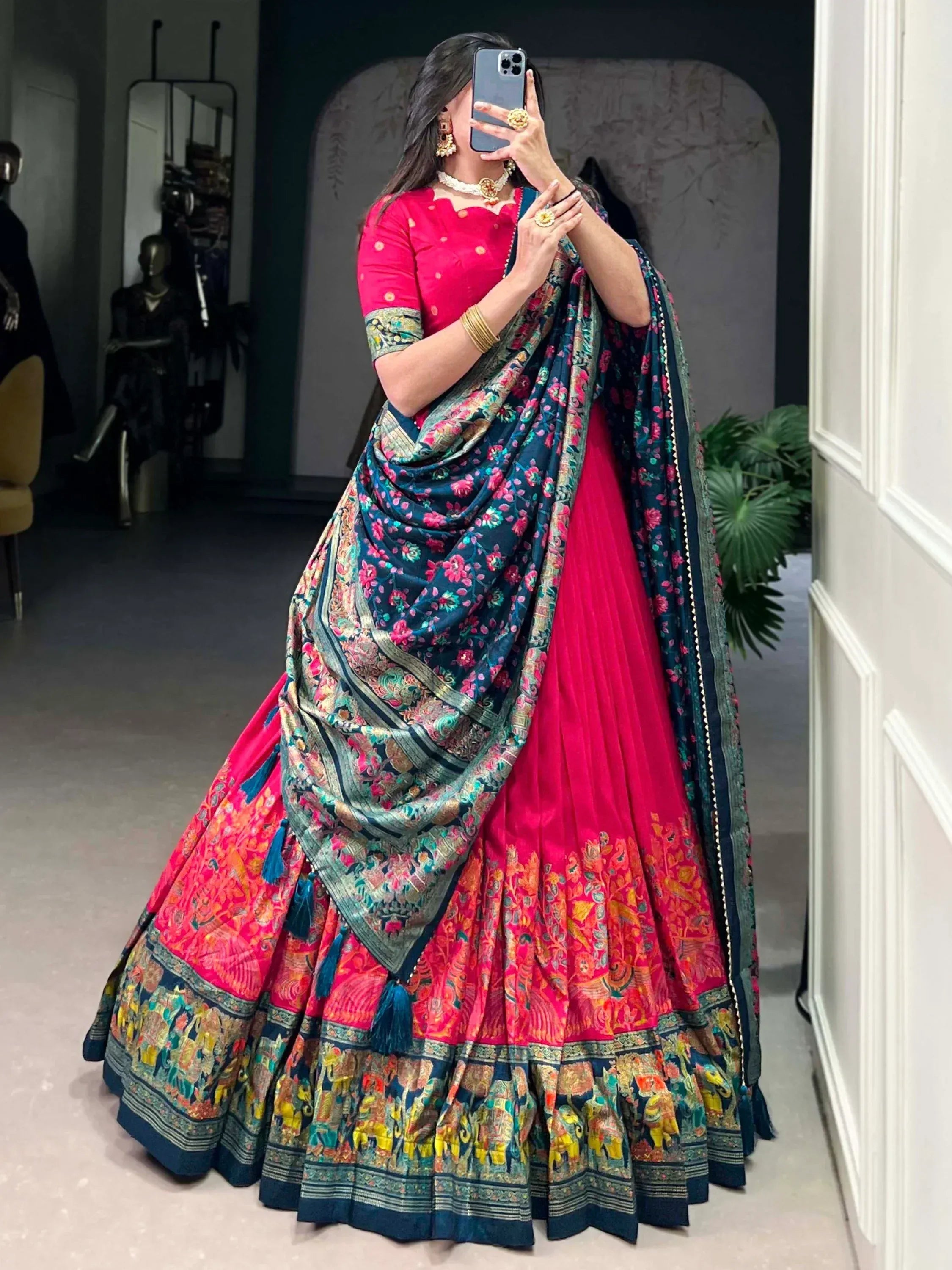 Vibrant pink lehenga choli with floral dupatta, perfect for Indian ethnic wear and festive occasions.