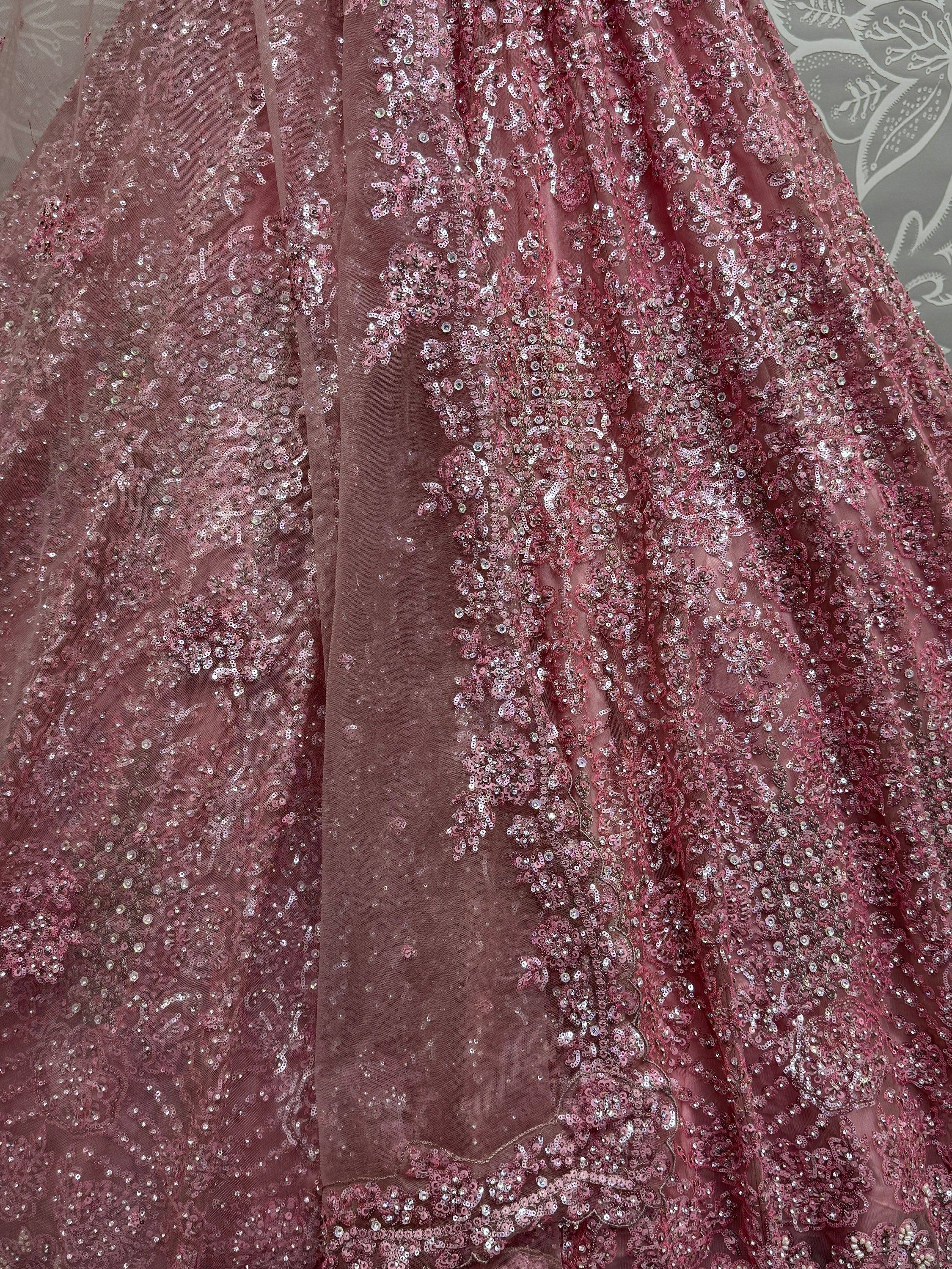 Dusty rose sequin-embellished ethnic gown with floral patterns, perfect for Indian weddings and festive occasions.