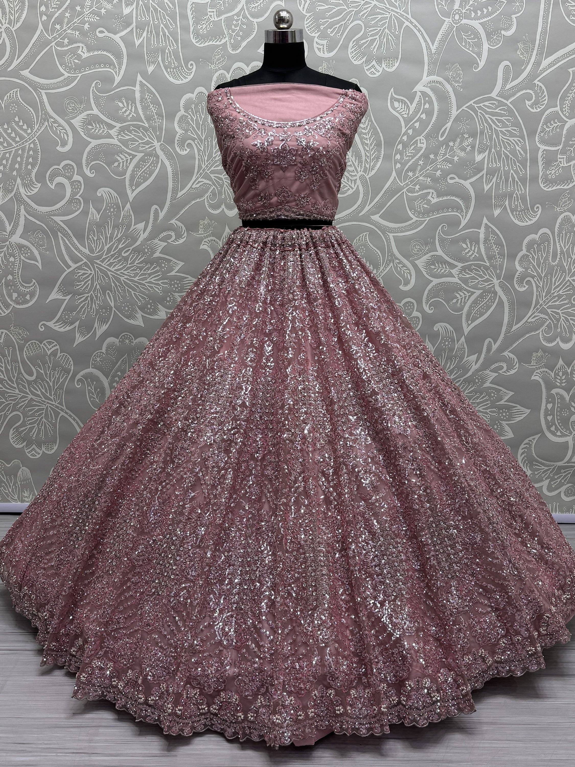 Dusty pink embroidered lehenga choli with sequin work, perfect for Indian weddings and festive occasions.