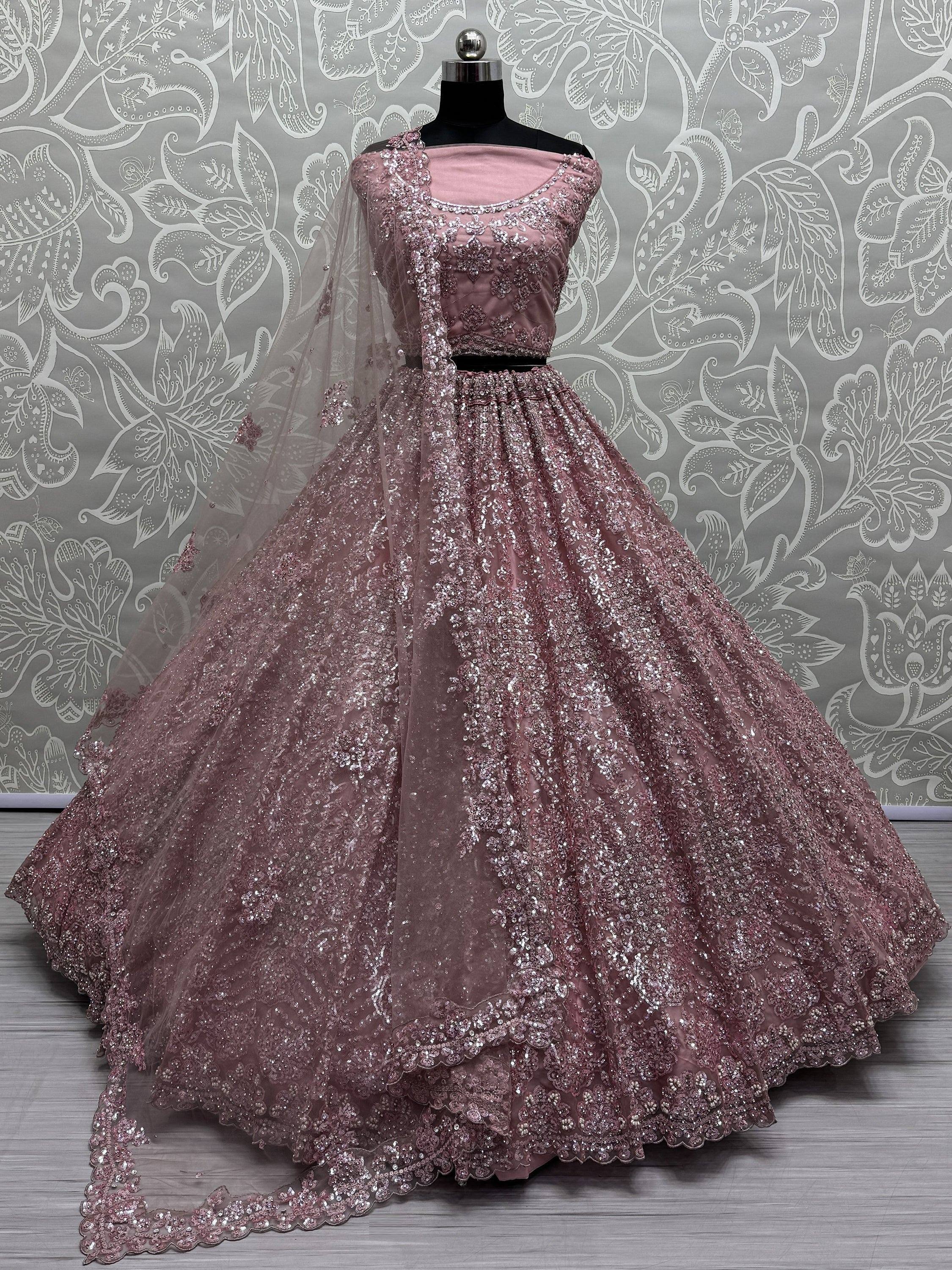 Pink designer lehenga choli with heavy sequin embroidery and net dupatta, perfect for weddings and parties