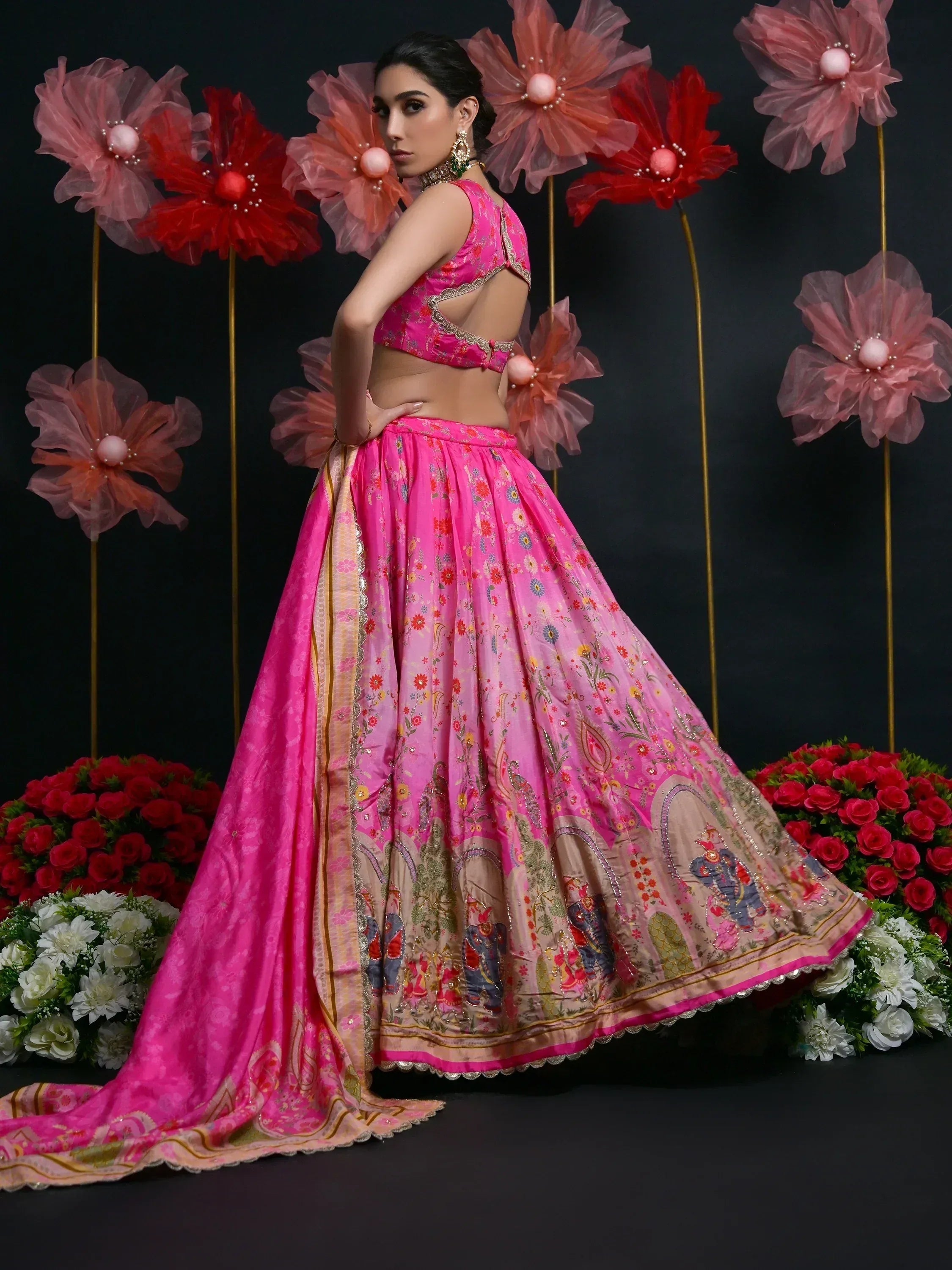 Pink floral lehenga choli with elephant motifs, perfect for Indian weddings and festive occasions.