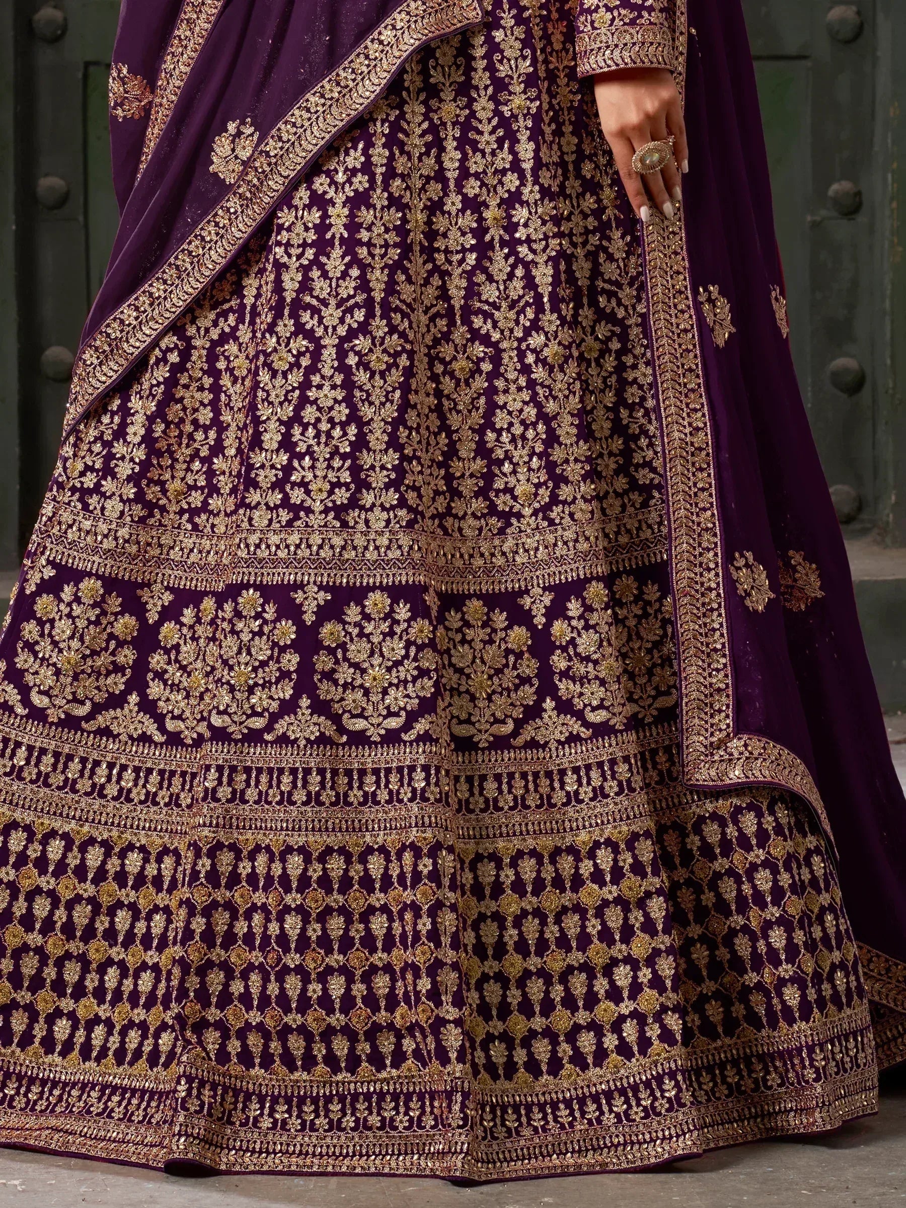 Purple designer lehenga choli with intricate gold embroidery, perfect for Indian ethnic wear occasions