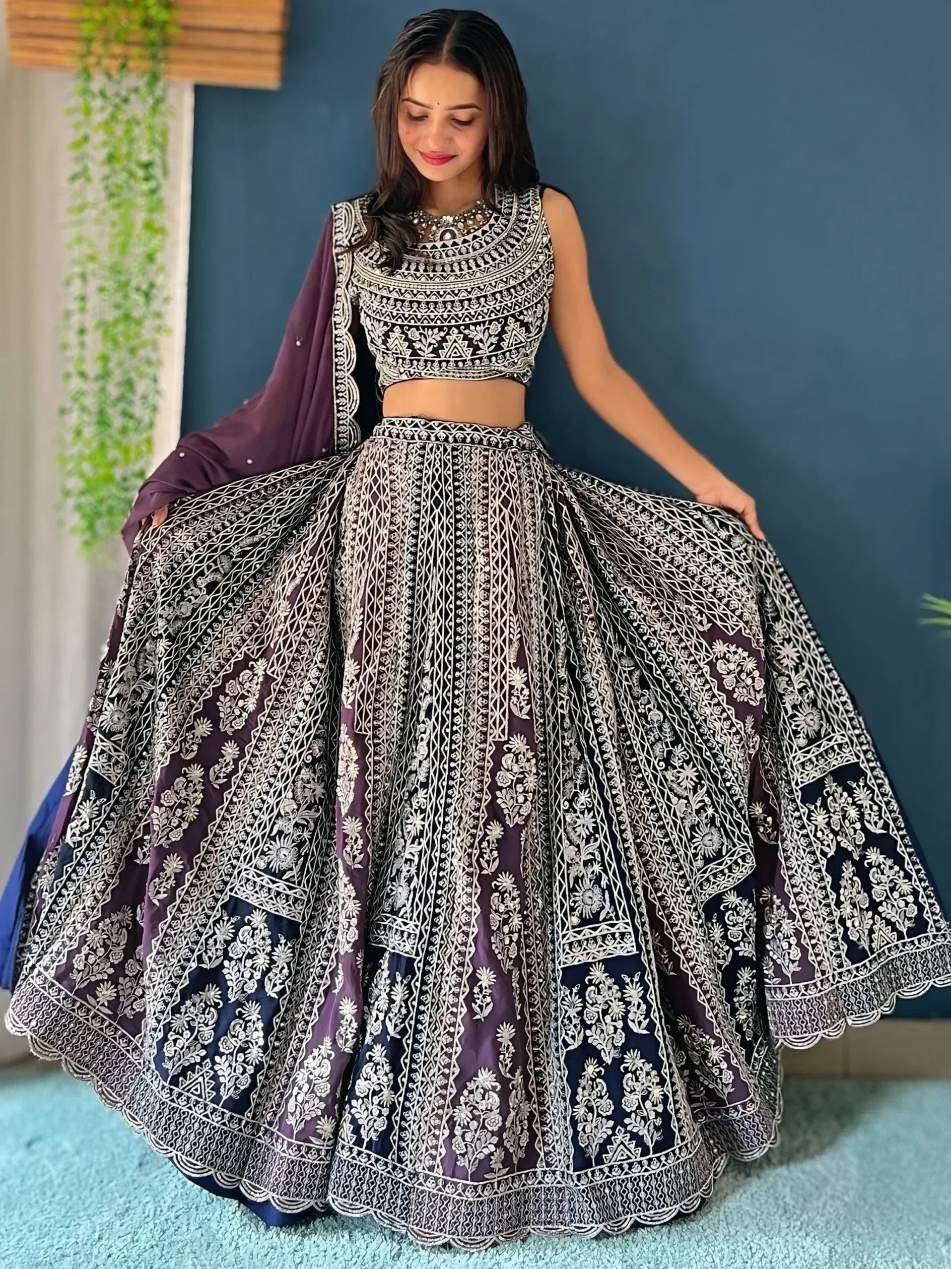 Elegant purple and navy lehenga choli with intricate white embroidery, perfect for Indian ethnic wear occasions.