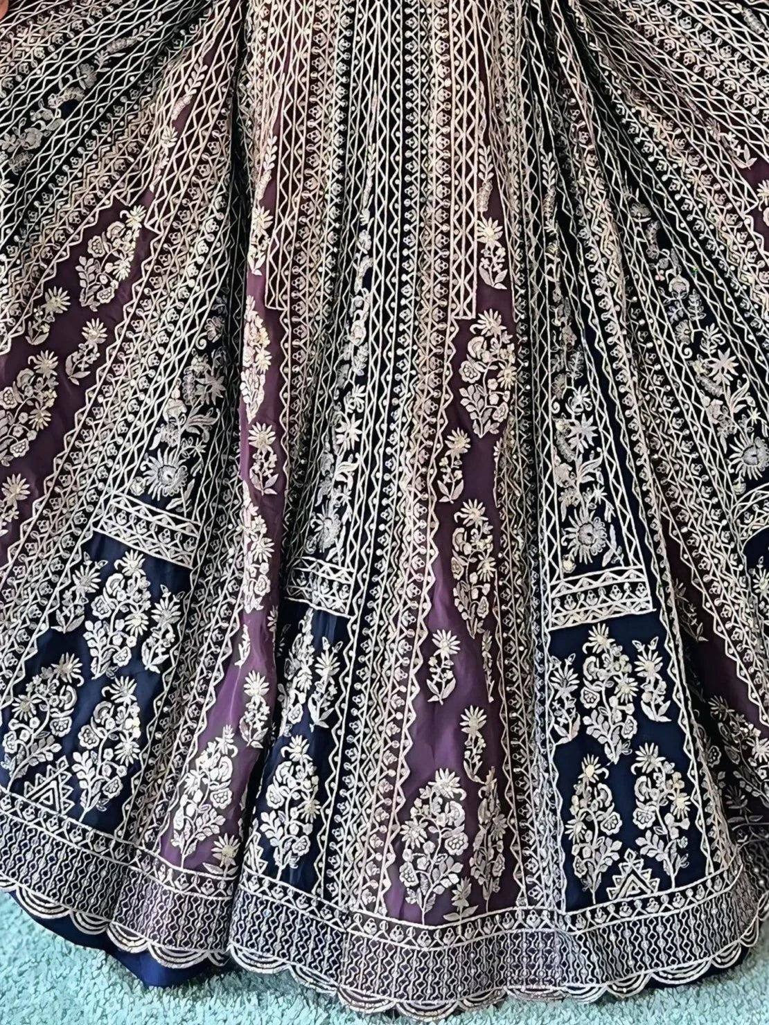 Purple and navy lehenga with intricate gold floral embroidery and scalloped hem, ideal for Indian ethnic wear.
