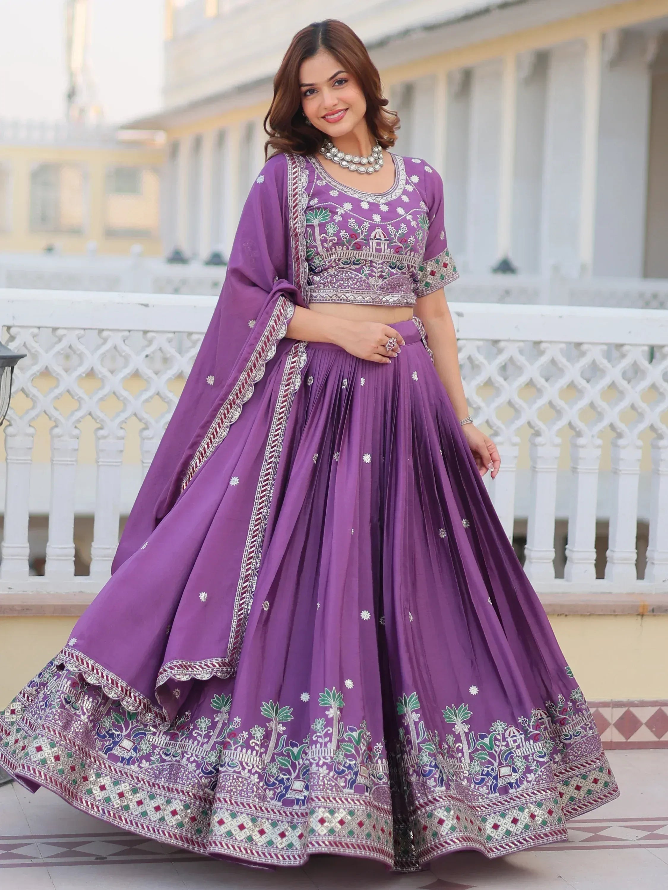 Purple embroidered lehenga choli with floral and elephant motifs, perfect for Indian ethnic occasions