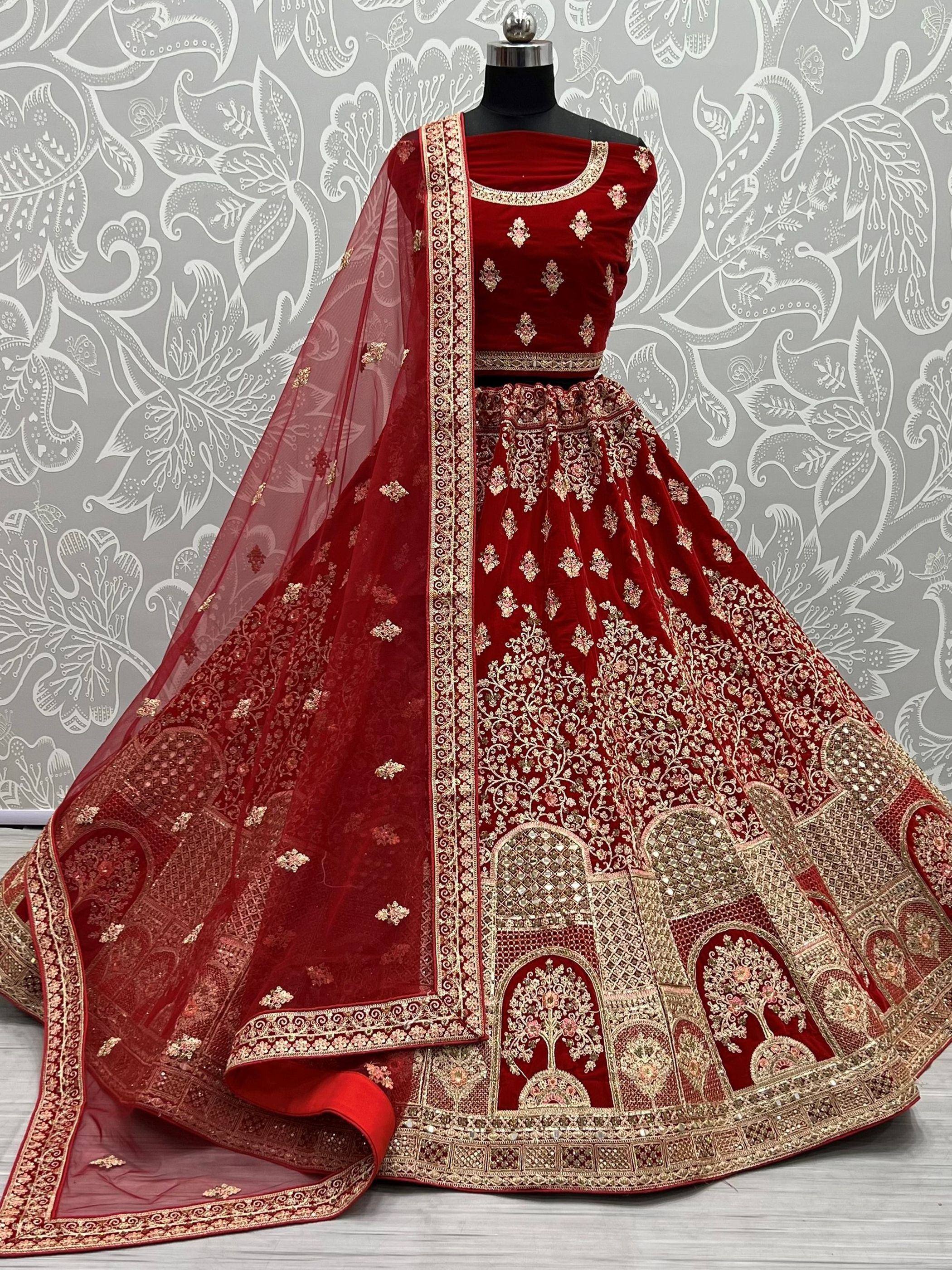 Red velvet designer lehenga choli with gold embroidery and sheer dupatta, ethnic Indian wear