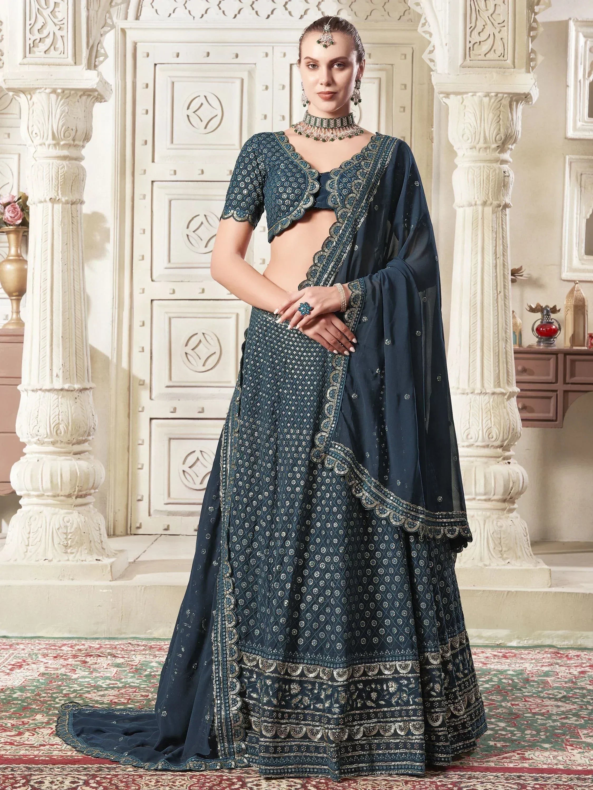 Elegant navy blue embroidered lehenga choli with dupatta, perfect for Indian ethnic occasions and weddings.