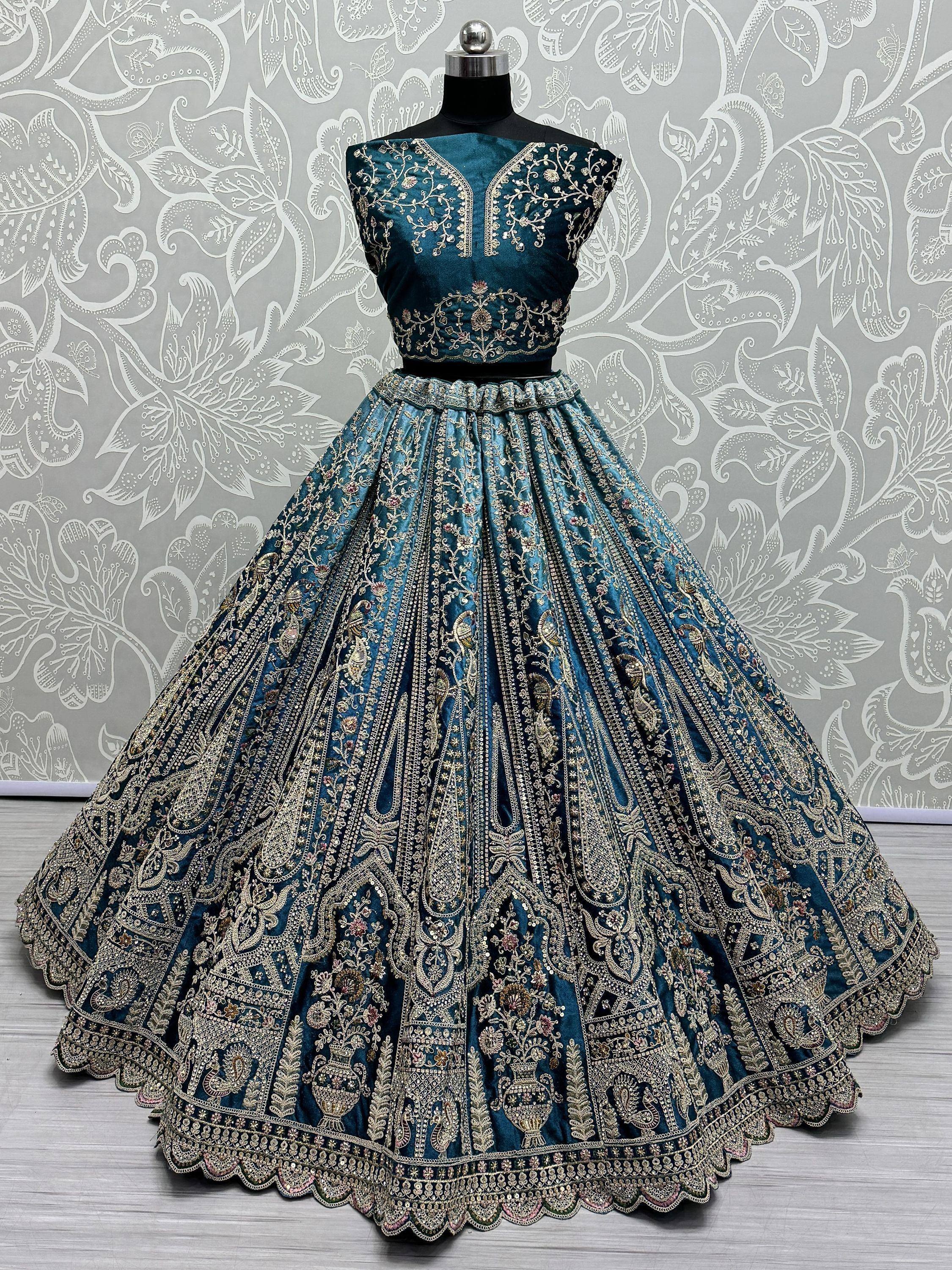 Teal blue embroidered lehenga choli with gold floral work, perfect for Indian weddings and festive occasions.