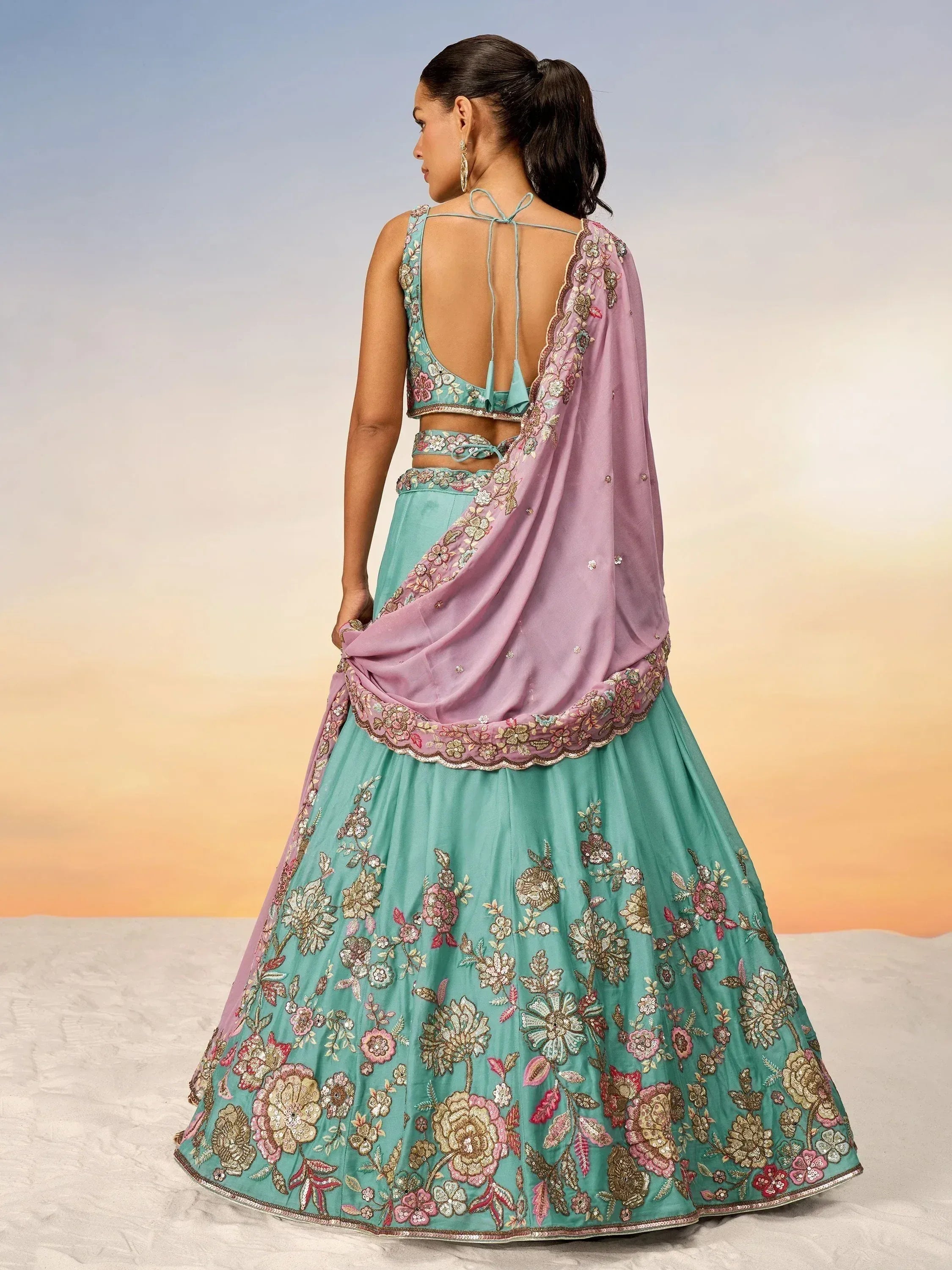 Teal floral embroidered lehenga choli with pink dupatta, back view, ethnic Indian wear