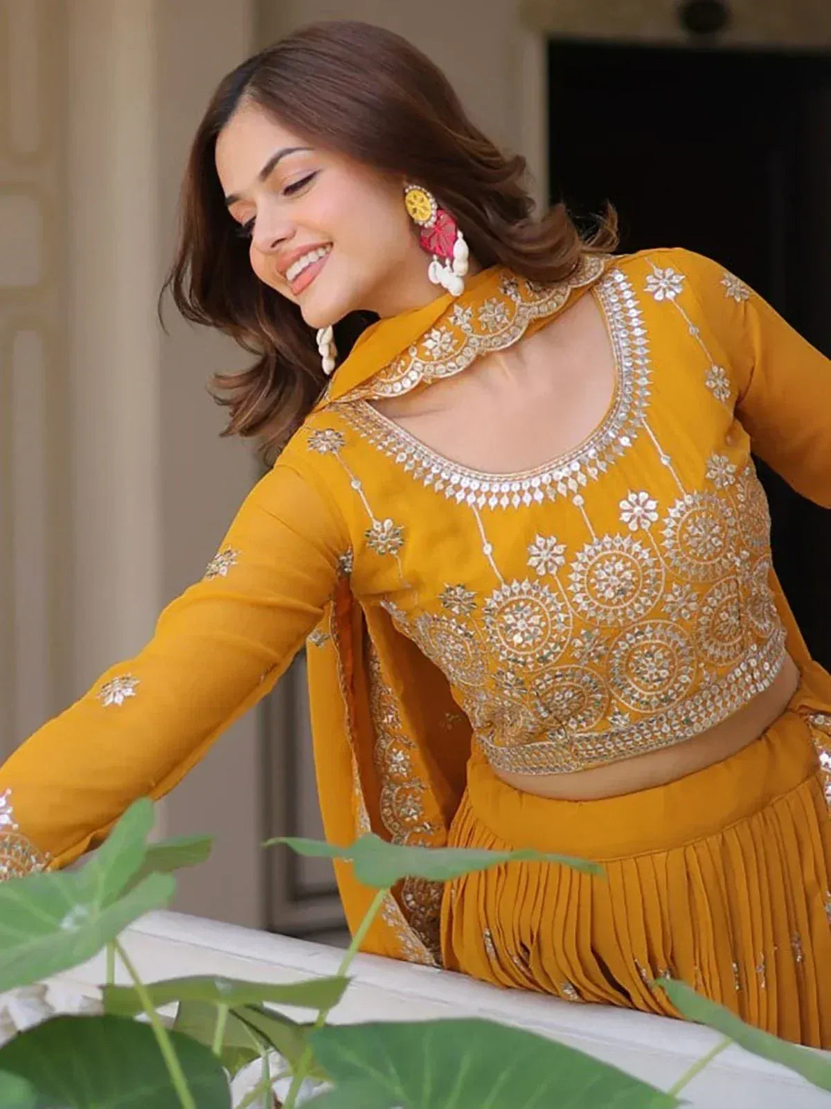 Mustard yellow embroidered lehenga choli with mirror work, perfect for Indian ethnic wear occasions