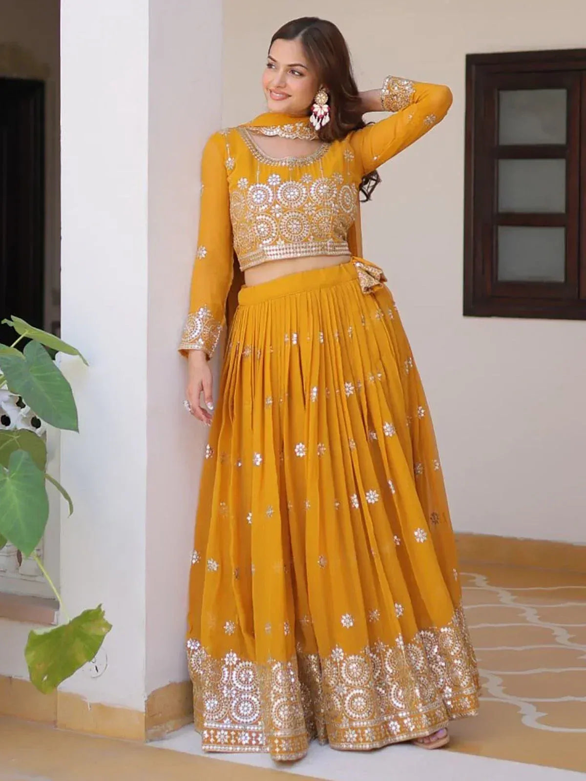 Mustard yellow embroidered lehenga choli with mirror work, perfect for Indian ethnic wear occasions