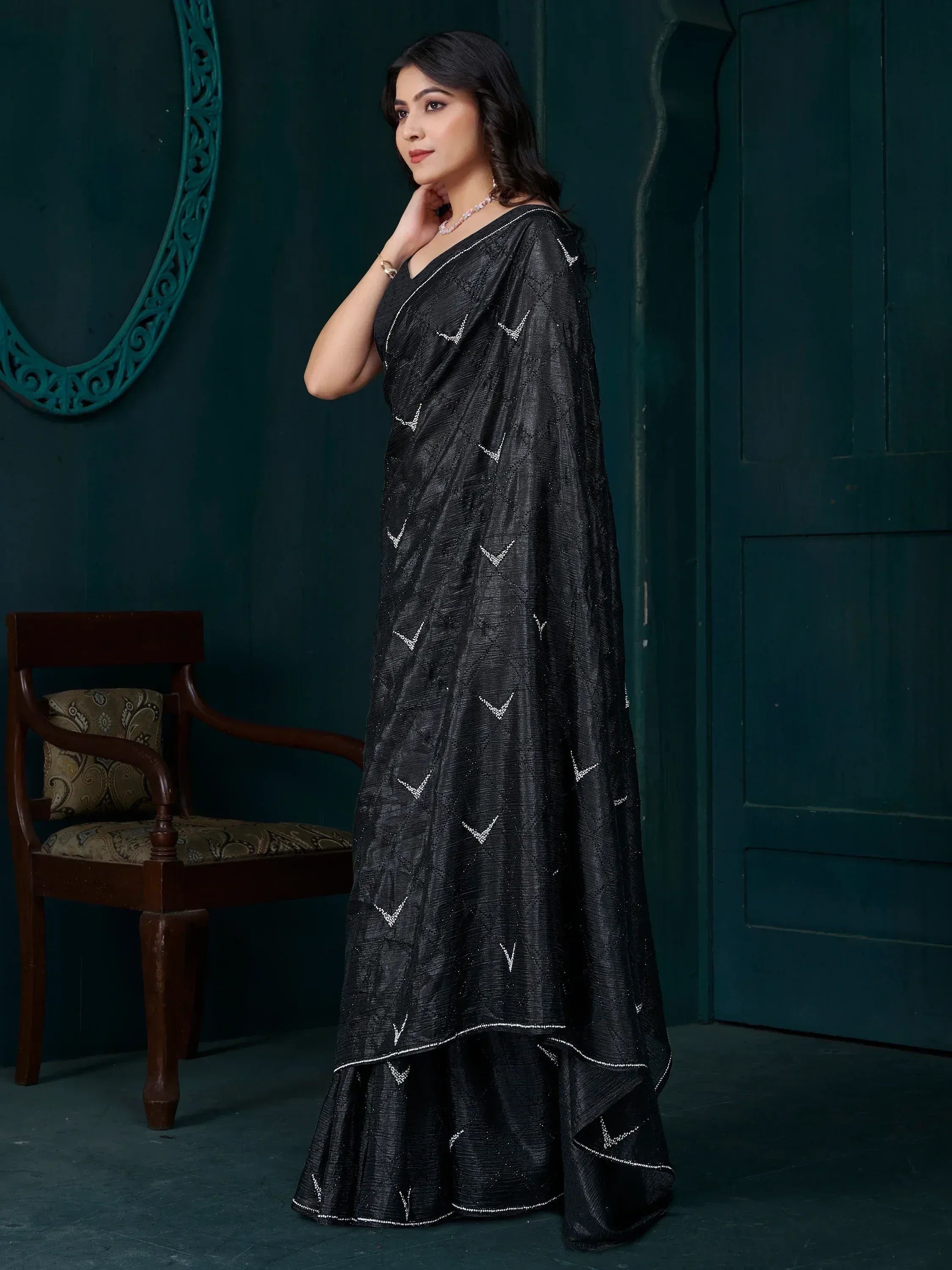 Black ethnic saree with silver V-pattern embroidery, perfect for Indian occasions and festive wear