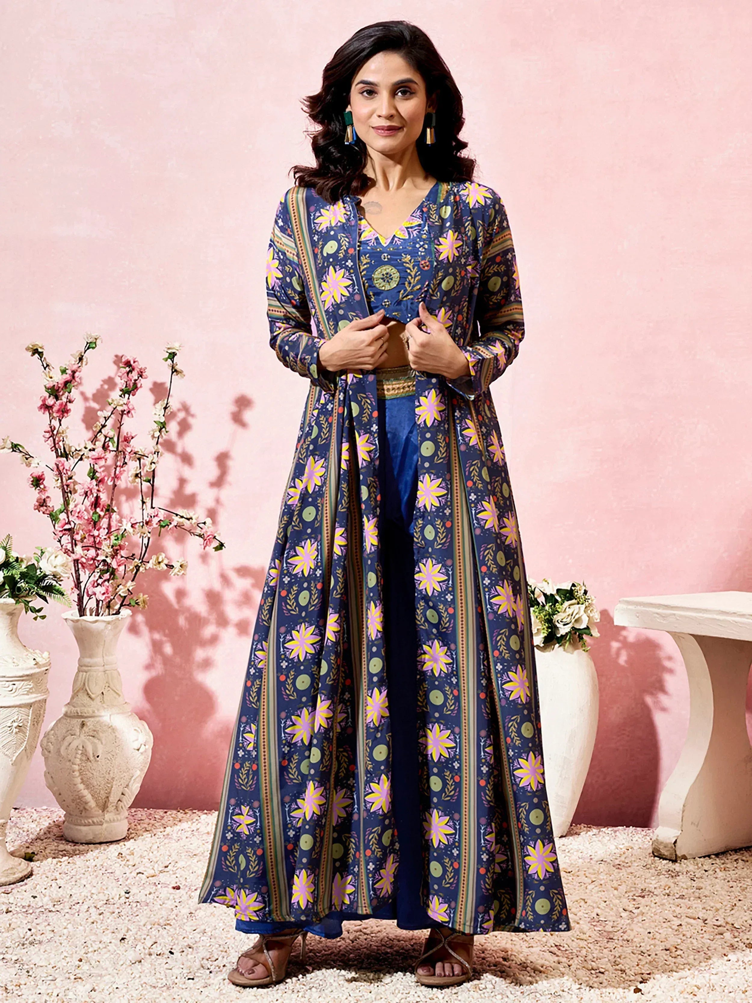 Woman in floral printed blue ethnic kurta set with palazzo pants, perfect for Indian occasions