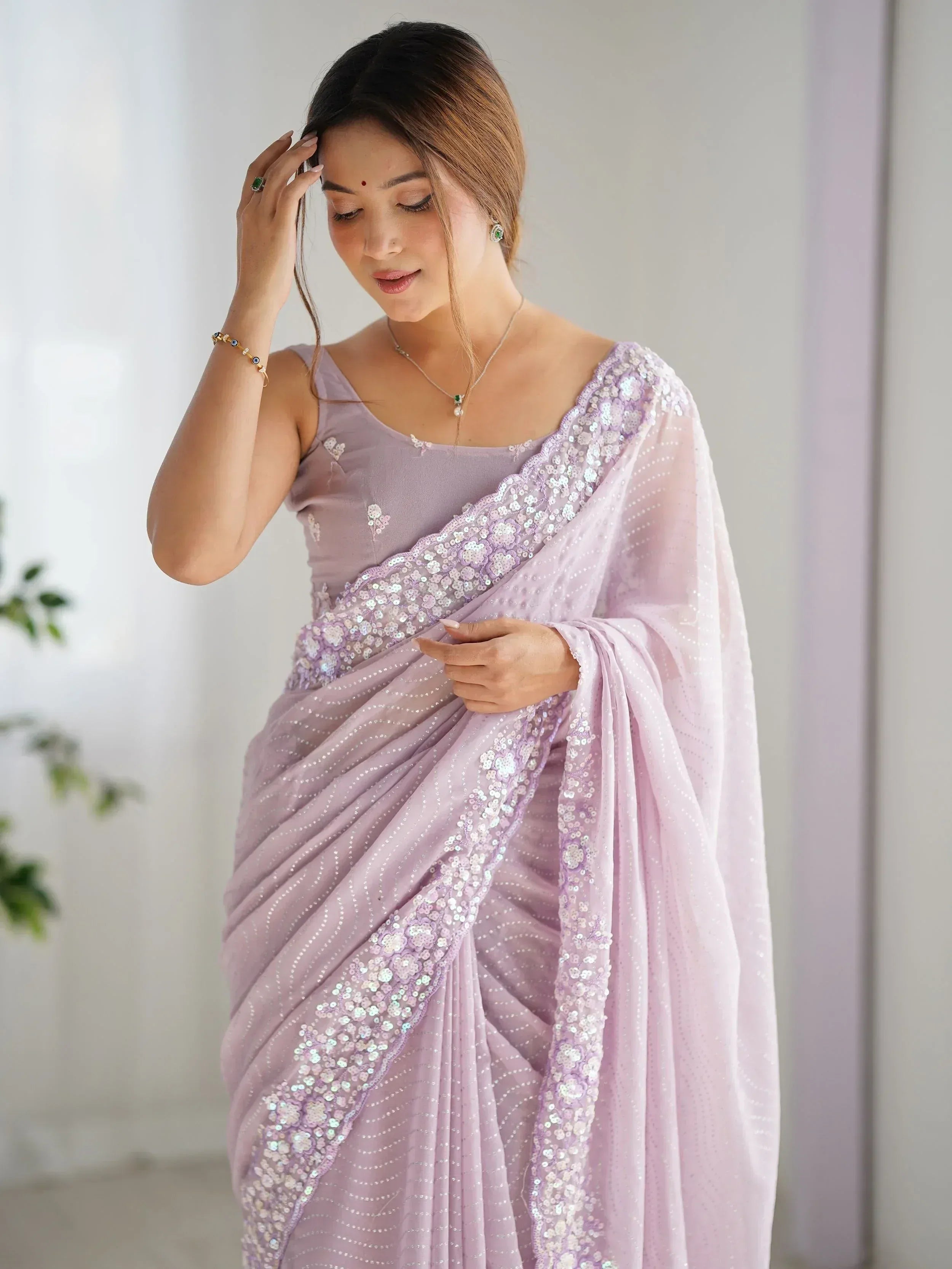 Lavender sequin saree with floral embroidery, perfect for Indian ethnic wear and festive occasions.