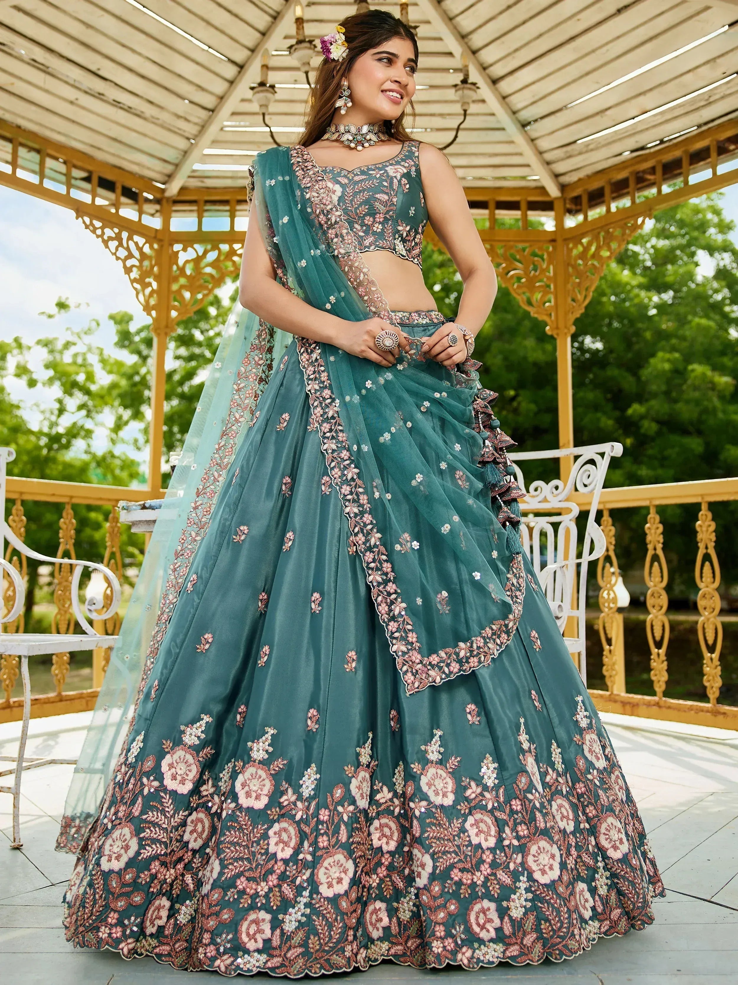 Teal floral embroidered lehenga choli with matching dupatta, perfect for Indian weddings and festive occasions.