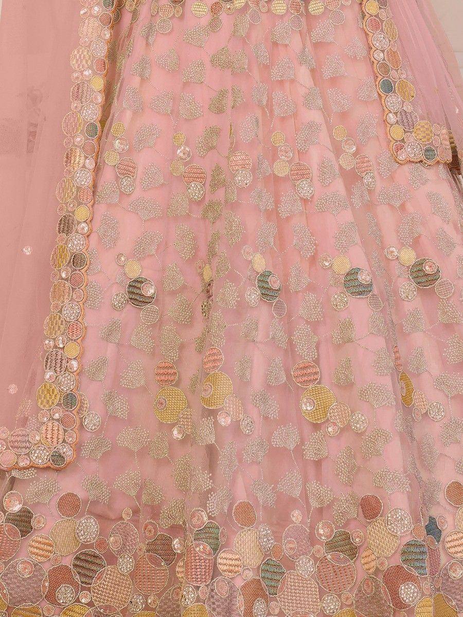 Pink designer lehenga with gold embroidery and colorful circular motifs, perfect for Indian ethnic wear.