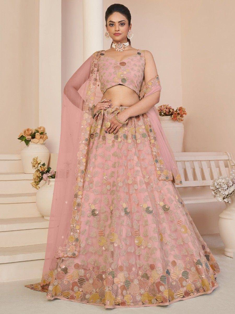 Pink embroidered lehenga choli with floral motifs, perfect for Indian weddings and festive occasions