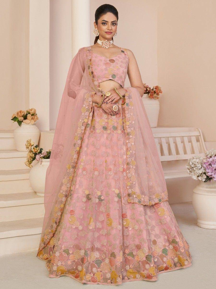 Pink embroidered lehenga choli with floral motifs, perfect for Indian weddings and festive occasions