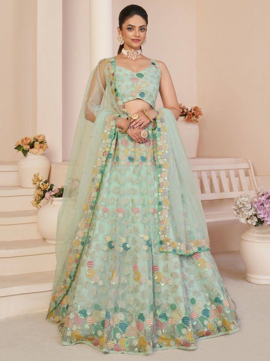 Mint green designer lehenga choli with colorful sequin embroidery, perfect for weddings and festive occasions.