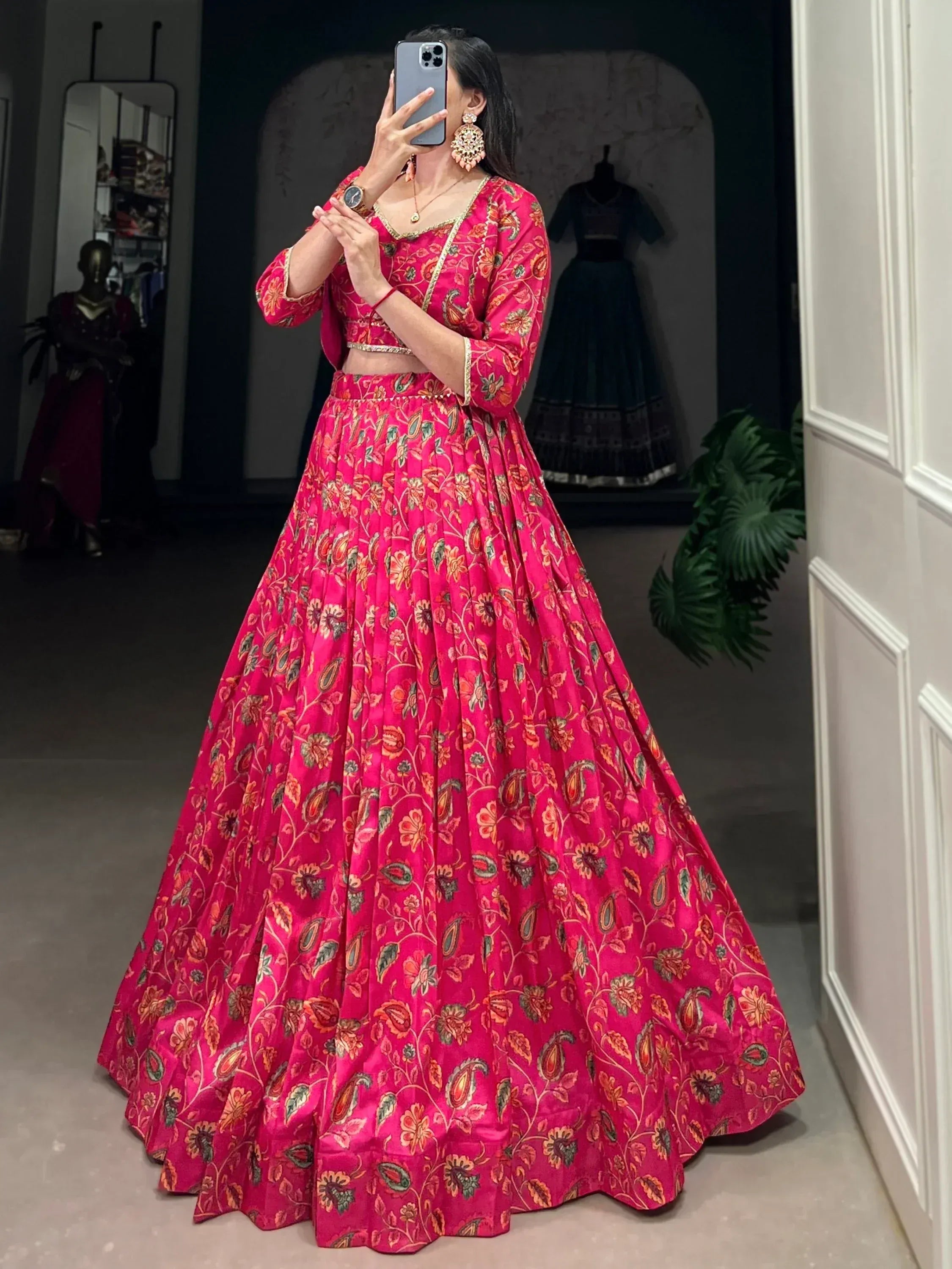 Vibrant pink floral lehenga choli with gold embroidery, perfect for Indian ethnic wear and festive occasions.