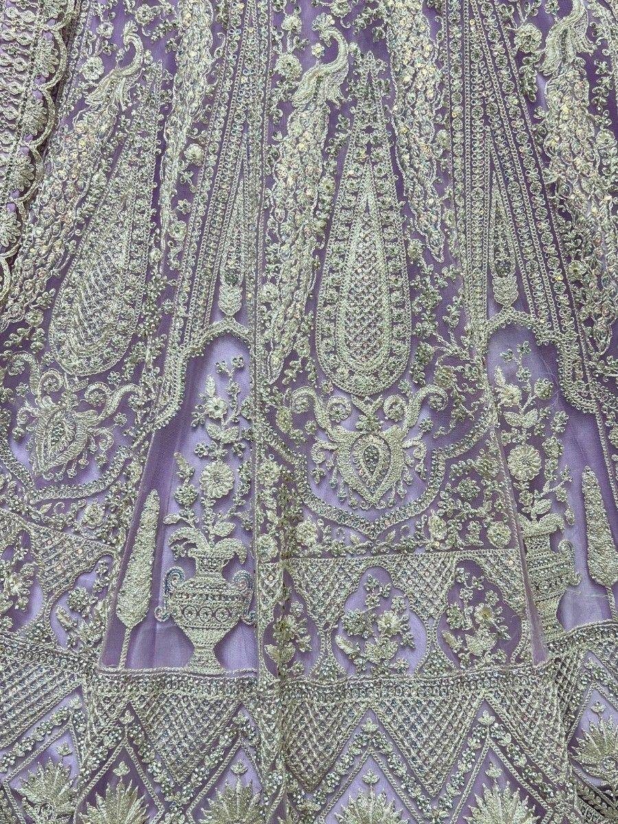 Lavish purple lehenga with gold embroidery and floral motifs, ideal for Indian ethnic wear