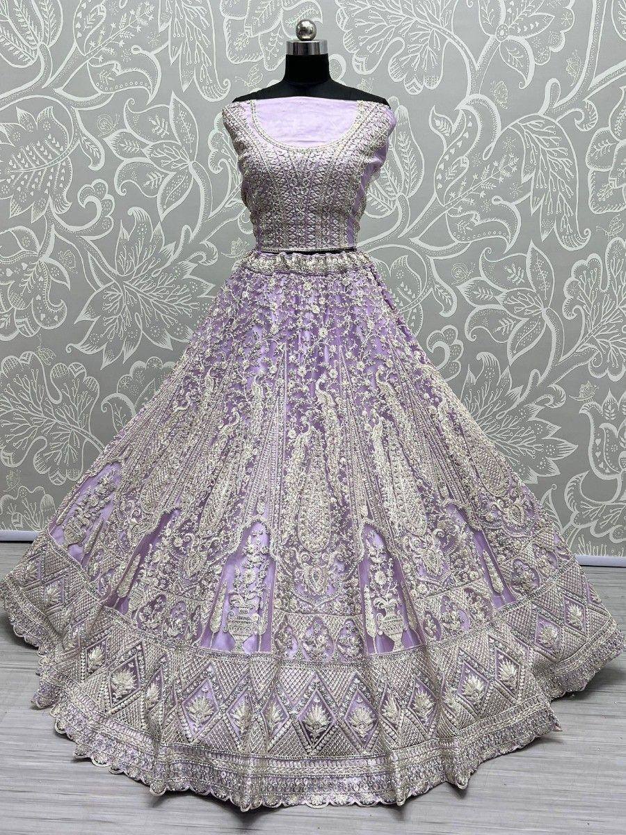 Lavender designer lehenga choli with heavy gold embroidery, perfect for Indian weddings and festive occasions.