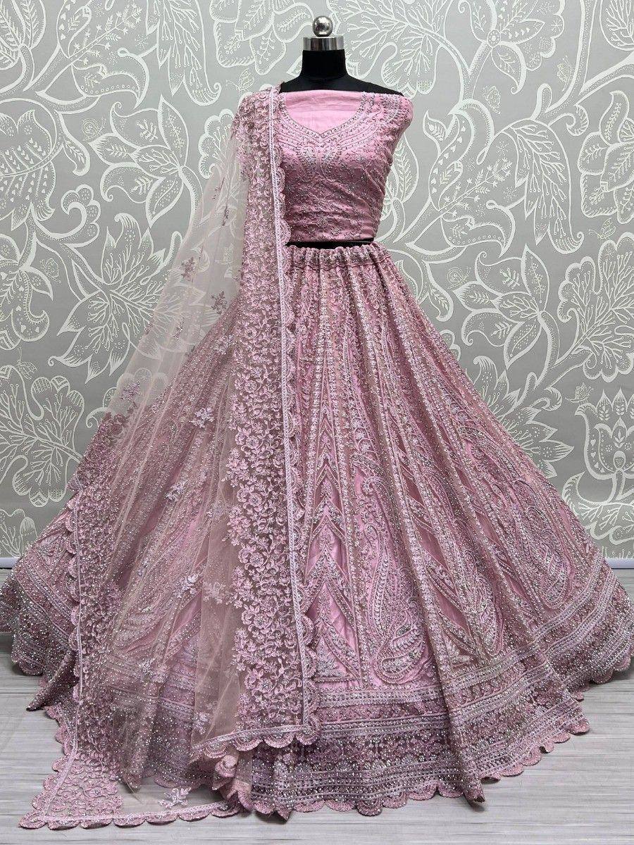 Pink designer lehenga choli with heavy embroidery and net dupatta, perfect for weddings and festive occasions