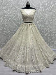 Captivating Cream Thread Work Net Reception Wear Lehenga Choli