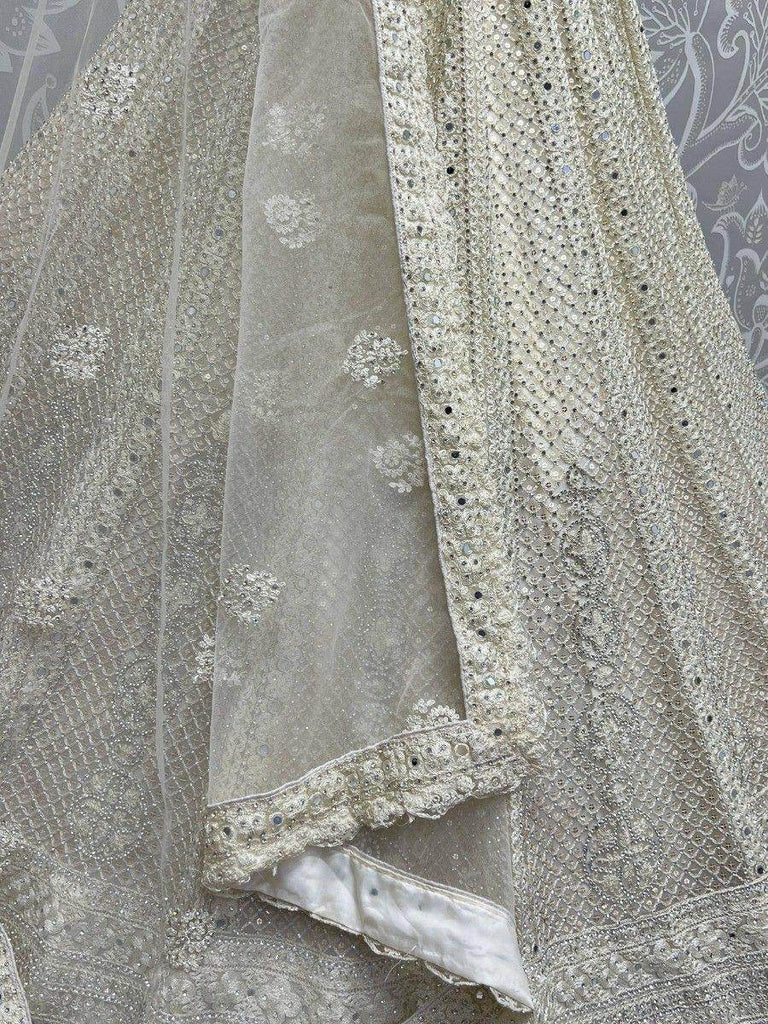 Captivating Cream Thread Work Net Reception Wear Lehenga Choli