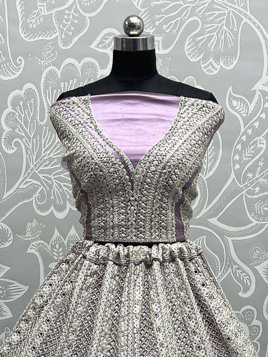 Lavender ethnic gown with heavy silver embroidery, perfect for Indian weddings and festive occasions.
