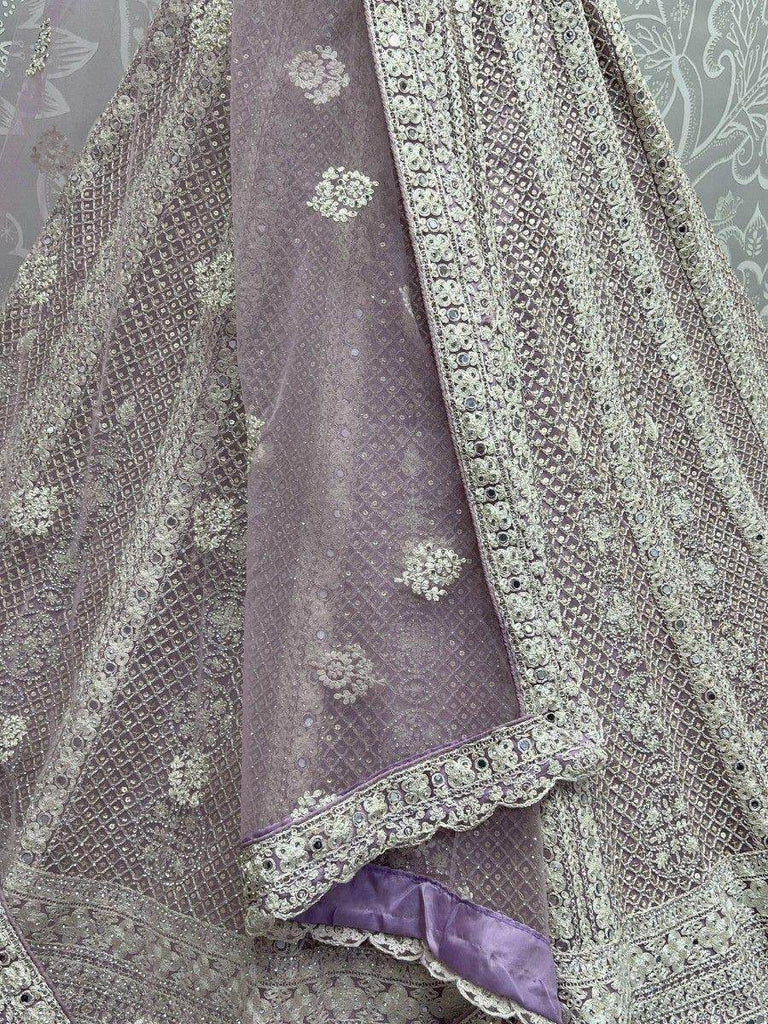 Fascinating Lavender Embroidered Net Lehenga Choli With Dupatta