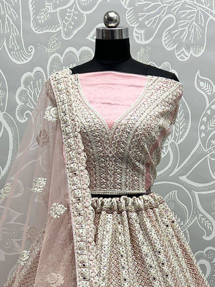 Pink designer lehenga choli with heavy embroidery and mirror work, perfect for weddings and festive occasions