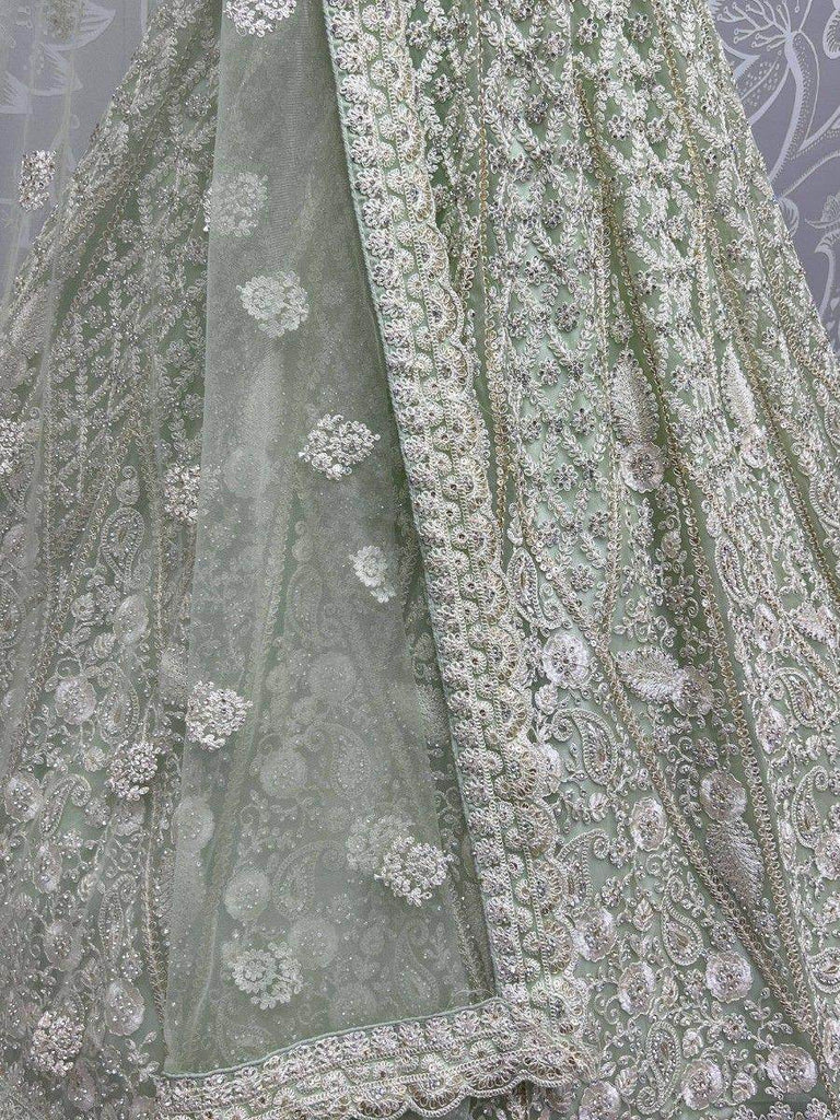 Beautiful Pista Green Embroidered Net Reception Wear Lehenga Choli