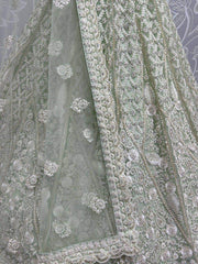 Beautiful Pista Green Embroidered Net Reception Wear Lehenga Choli