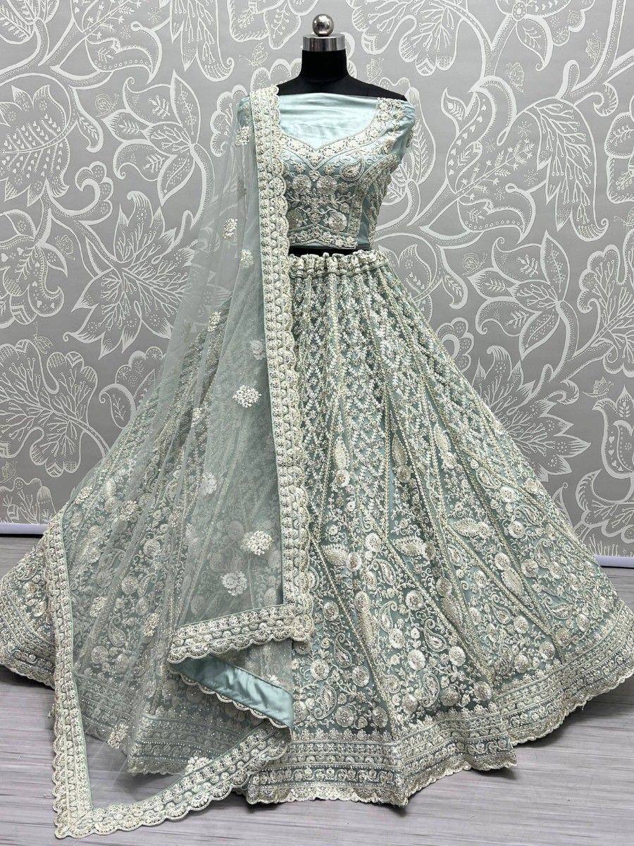 Mint green designer lehenga choli with heavy embroidery and matching dupatta, perfect for weddings and festivals