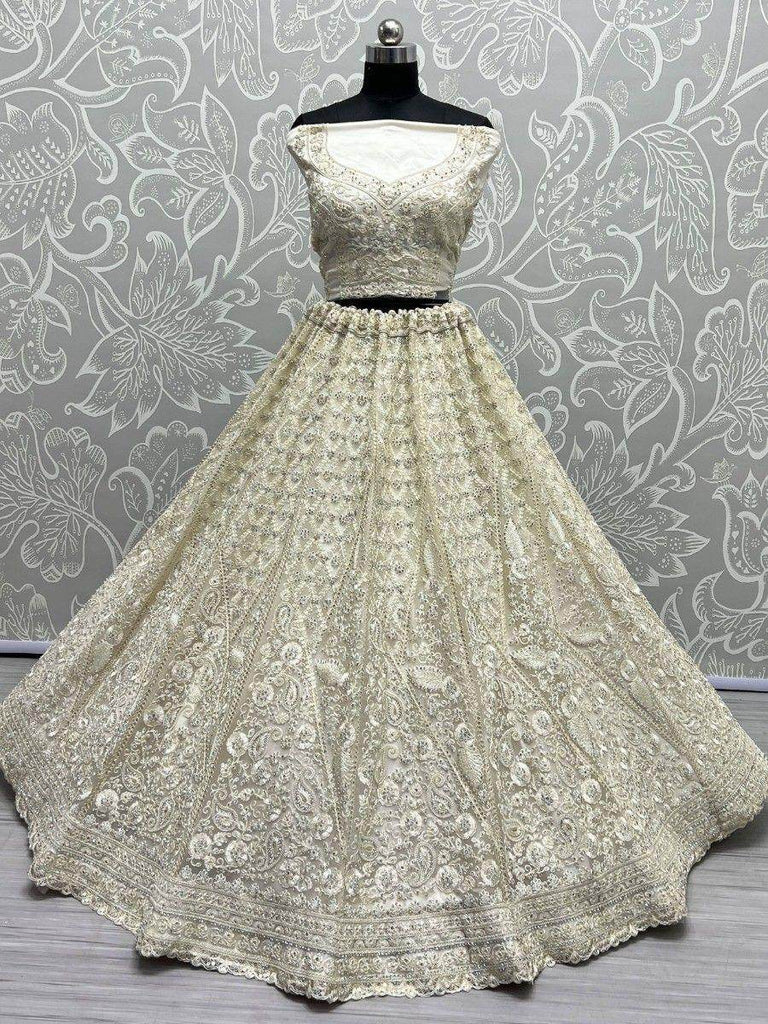 Ravishing Cream Thread Work Net Engagement Wear Lehenga Choli