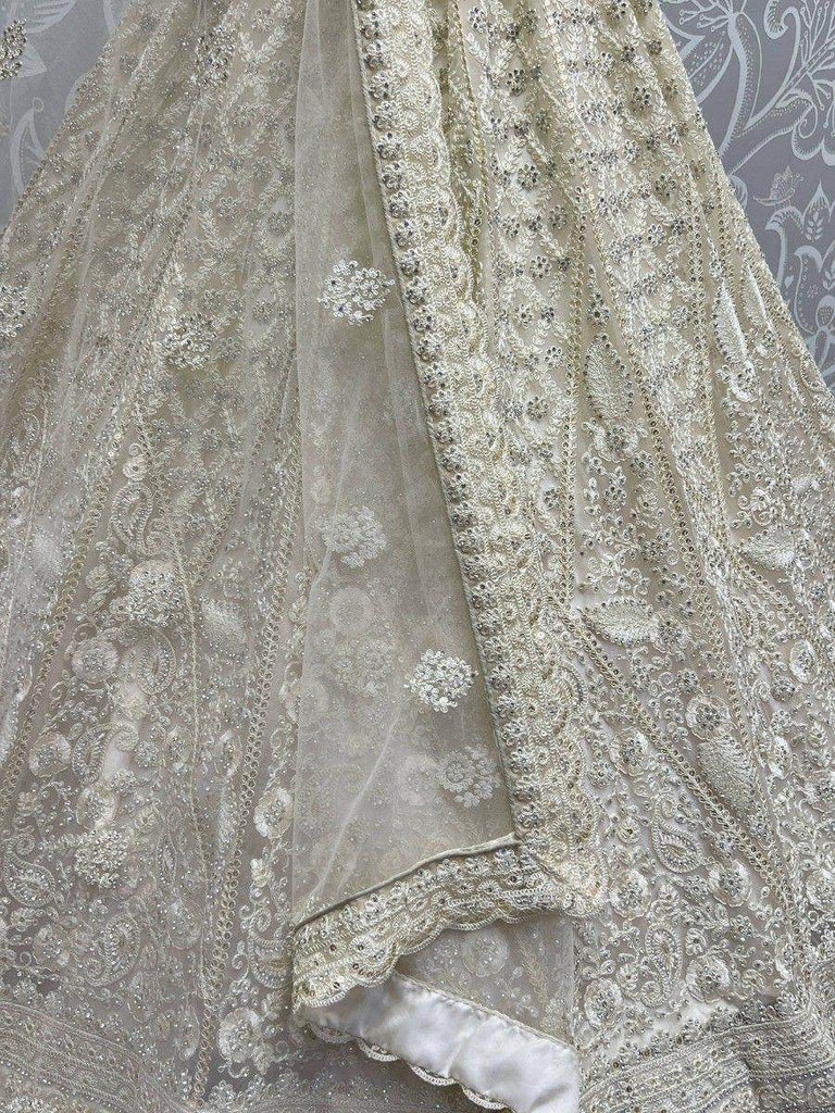 Ravishing Cream Thread Work Net Engagement Wear Lehenga Choli