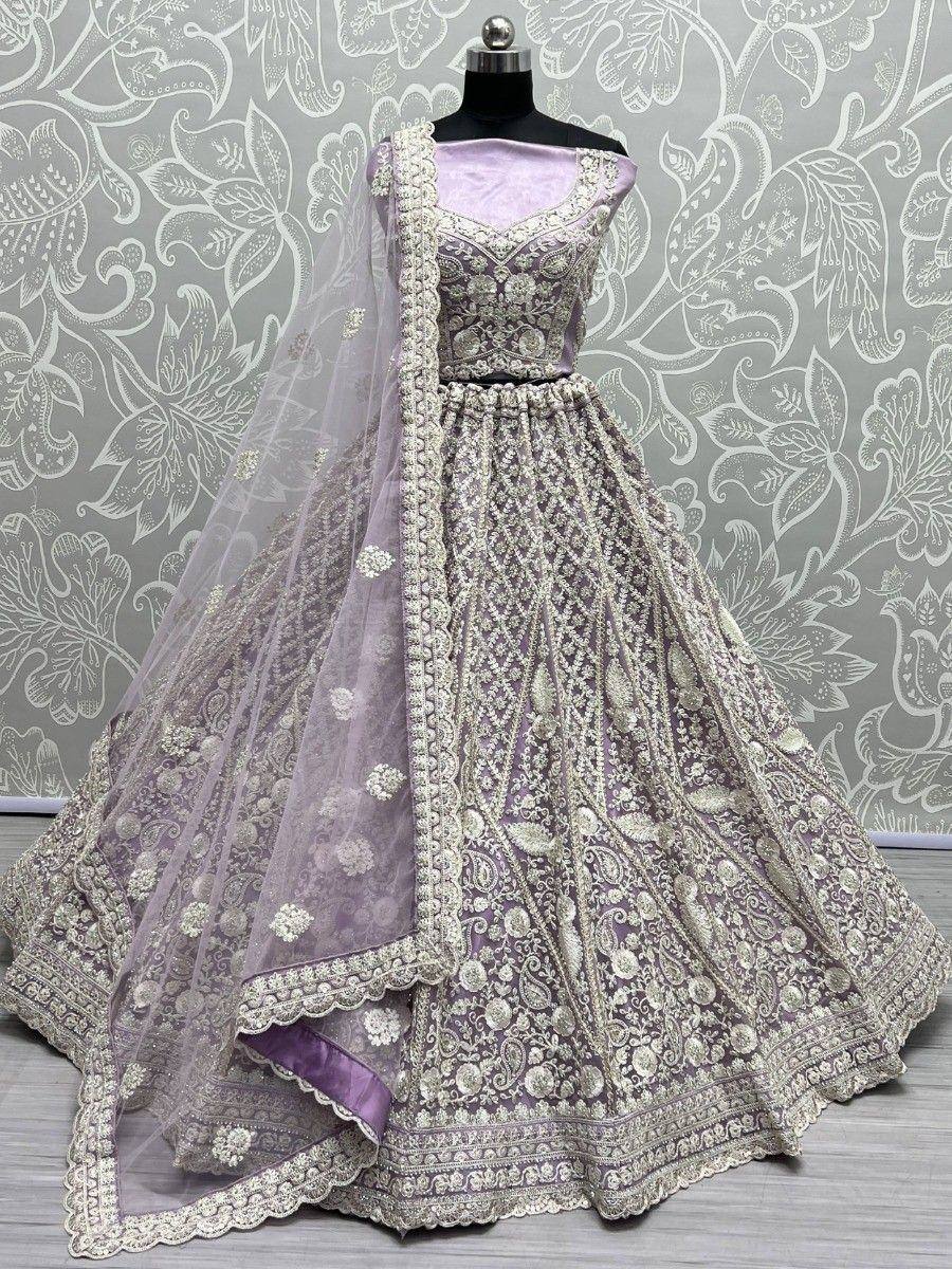 Lavender designer lehenga choli with heavy embroidery and matching dupatta, perfect for weddings and festive occasions.